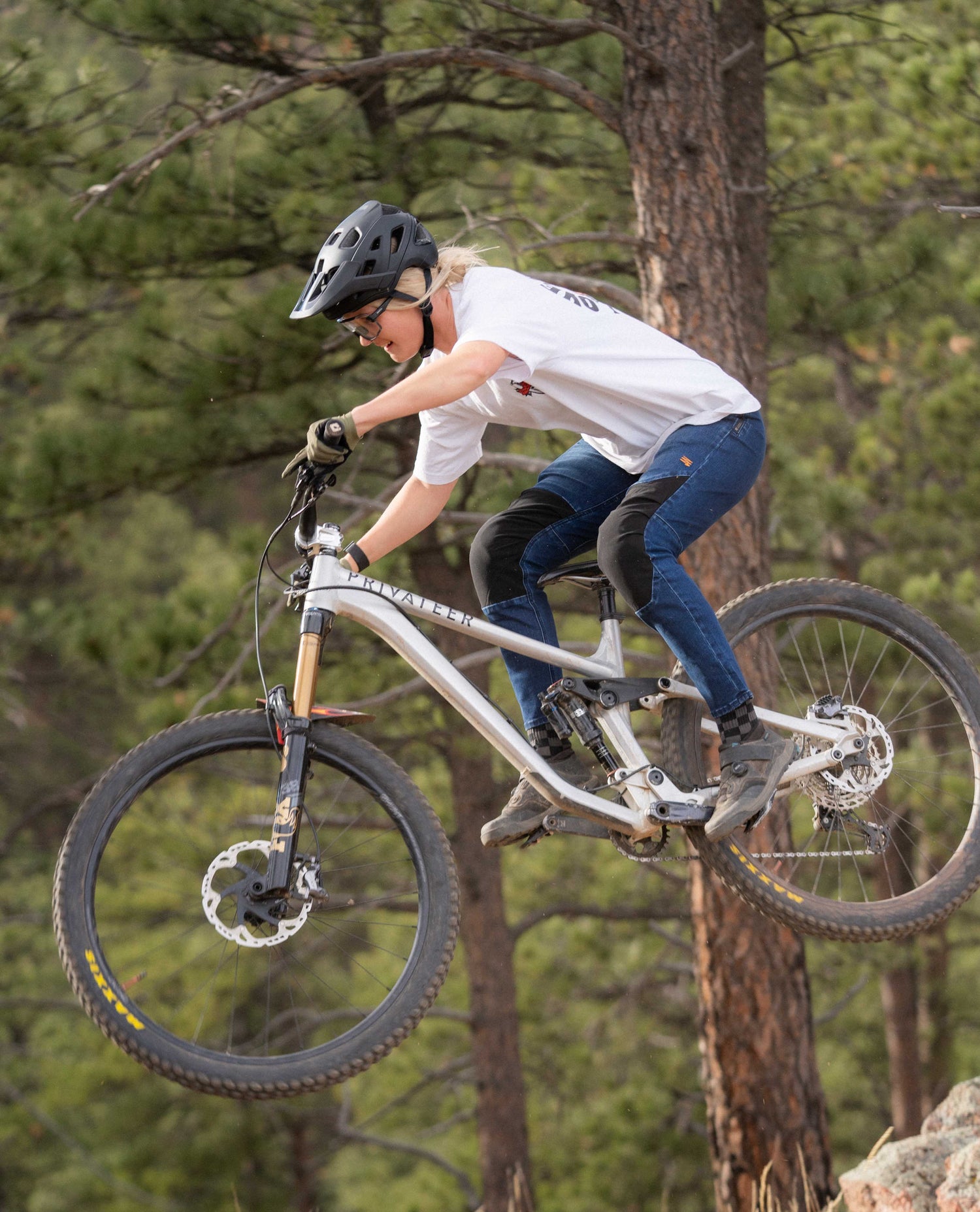 Hitting a jump in Women's Denim Bike Pant