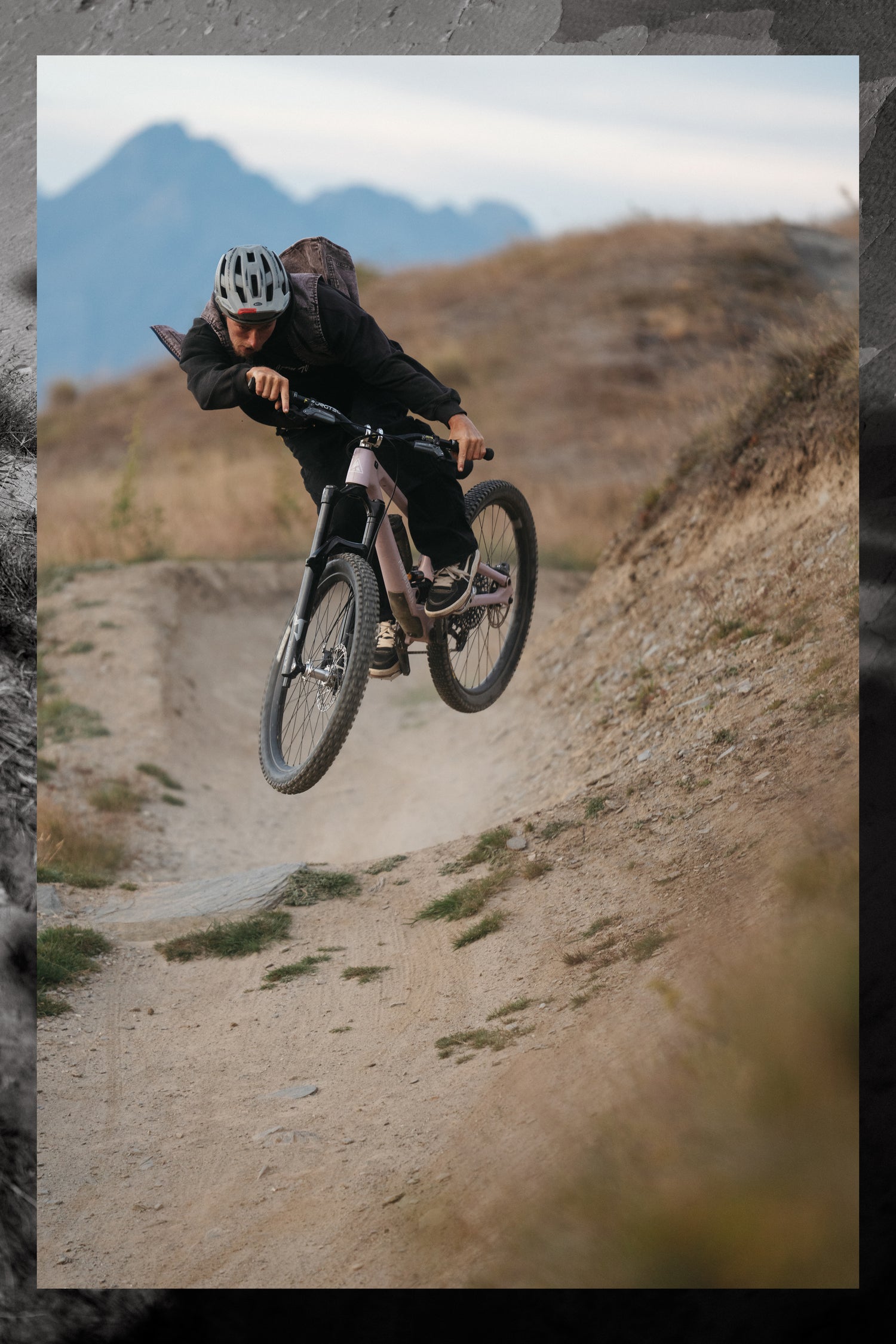 a person riding a mountain bike in the air