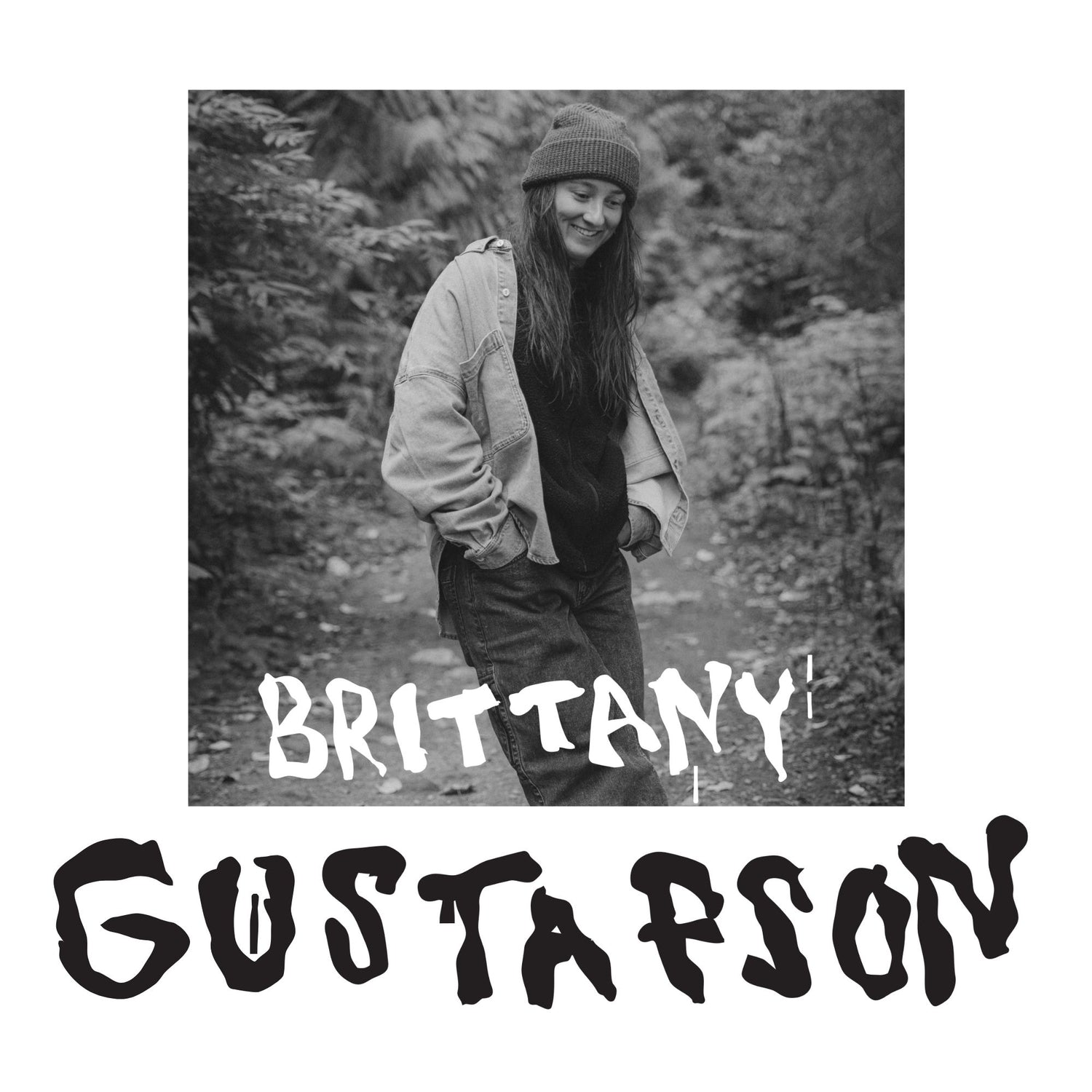 Britt standing in a forest with text overlay