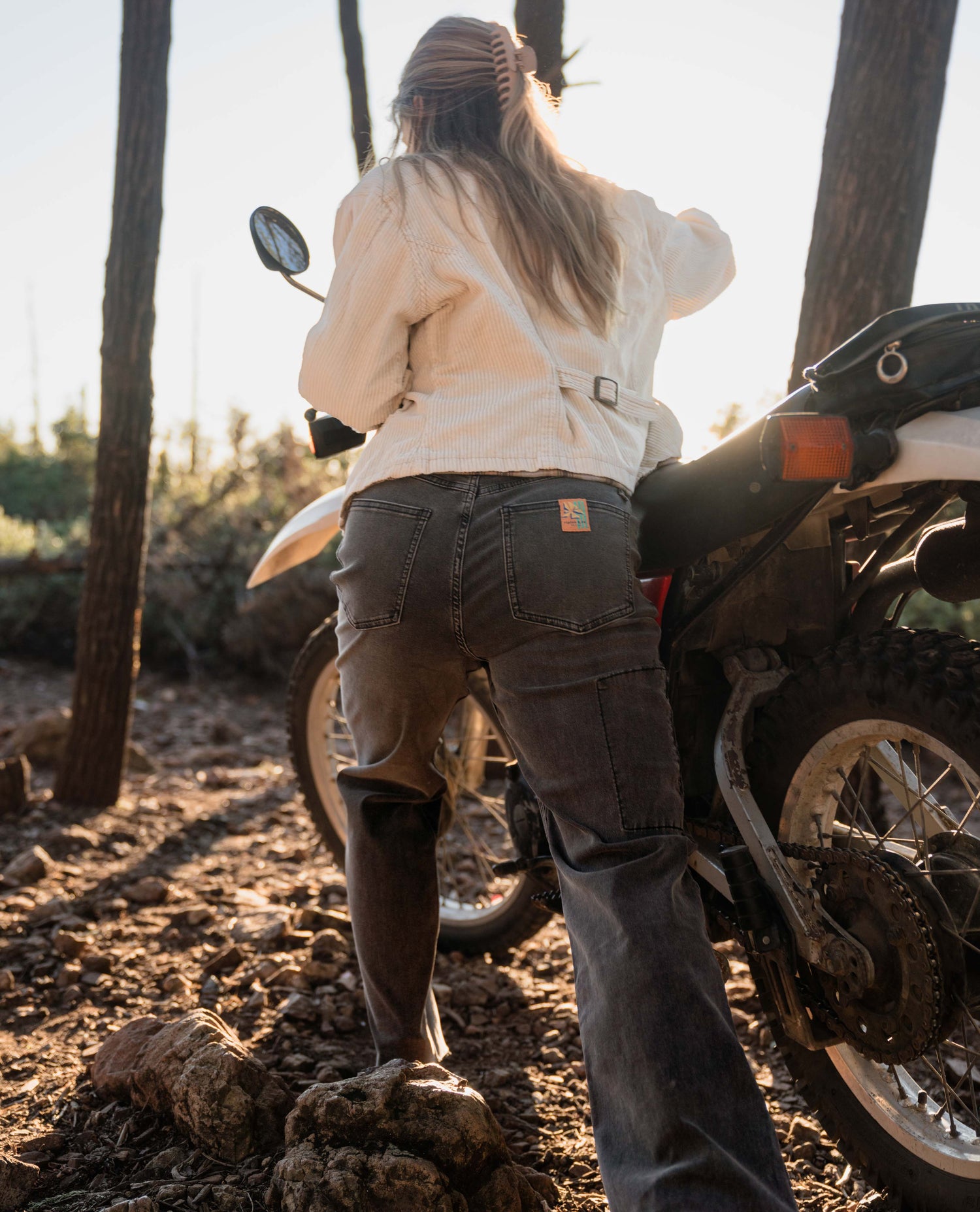 woman pushing motorcycle