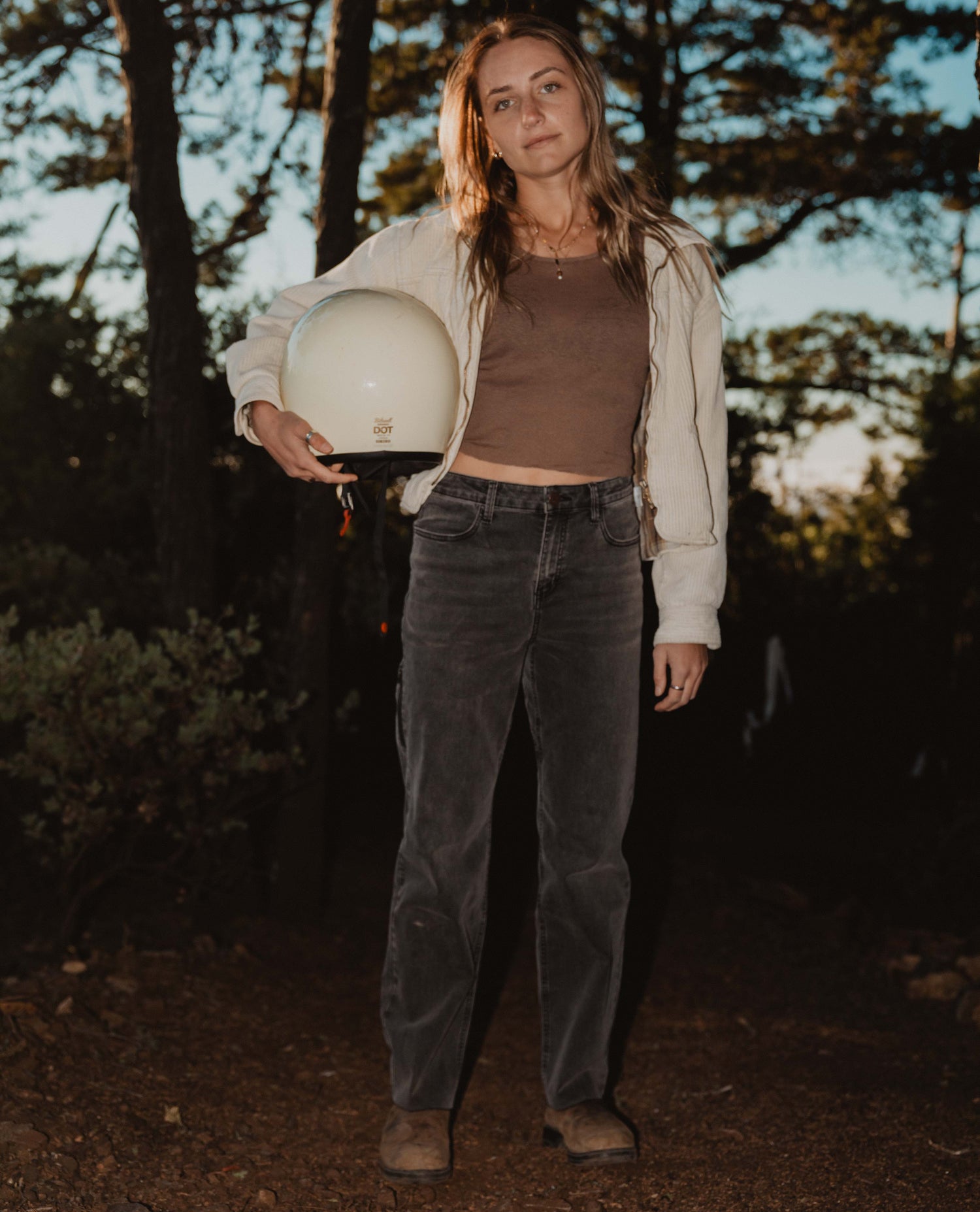 woman holding motorcycle helmet