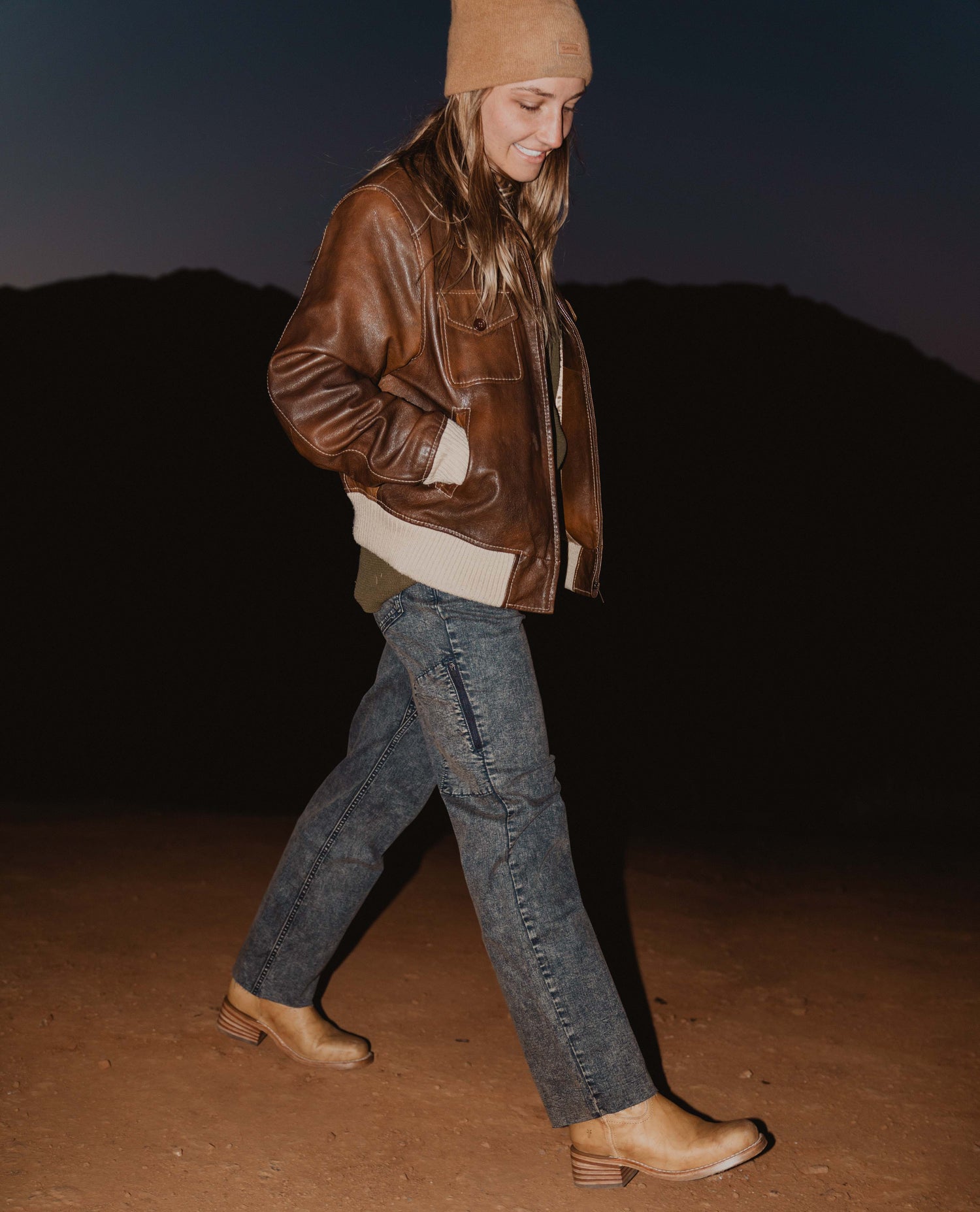 woman walking in the desert at night