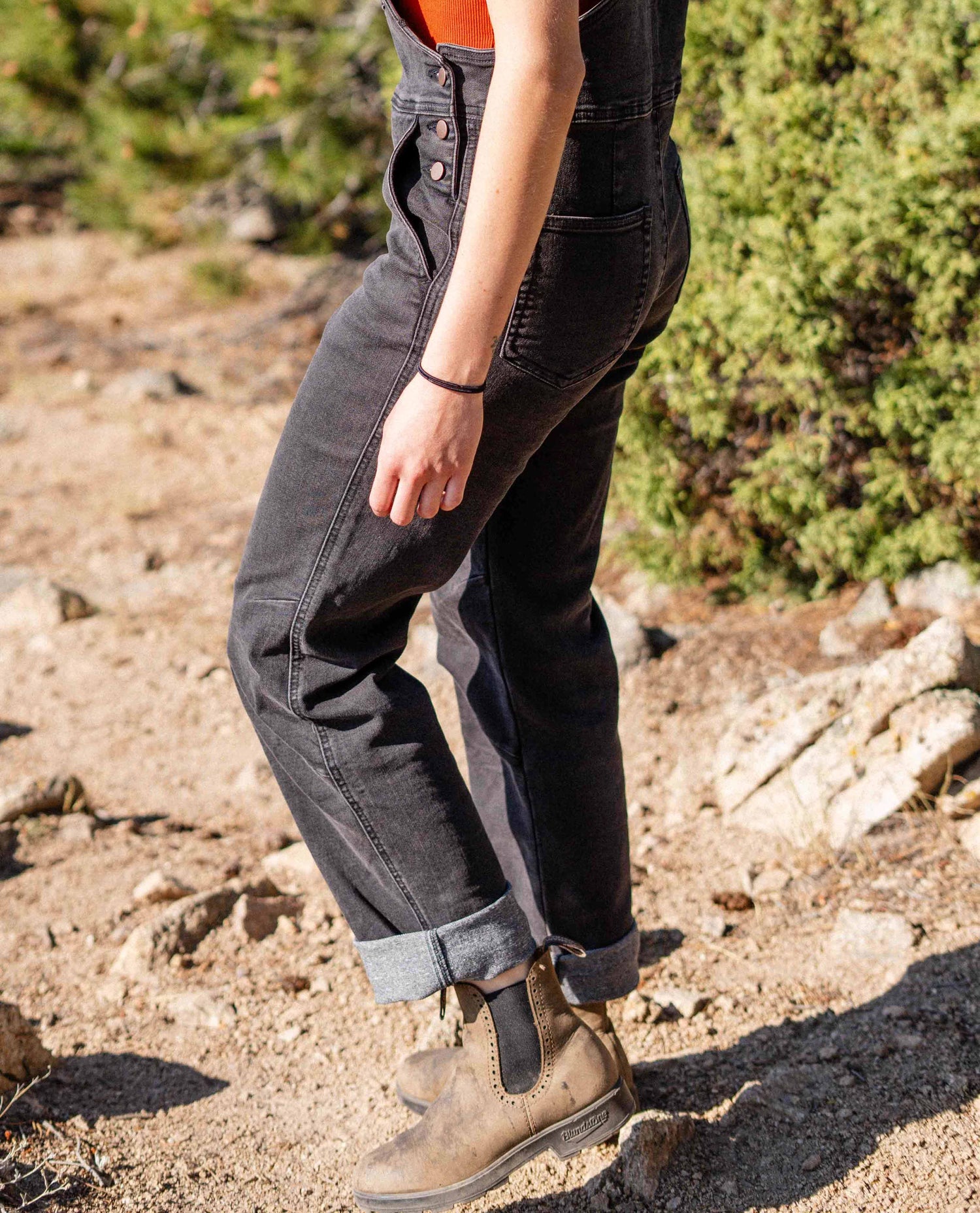 Woman walking in Diesel Overalls.