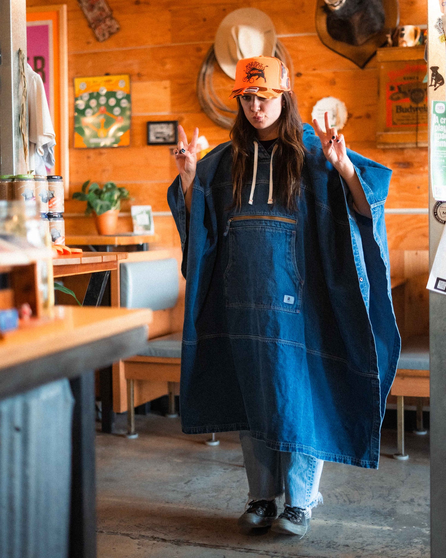 Person wearing a blue apron in a rustic kitchen setting