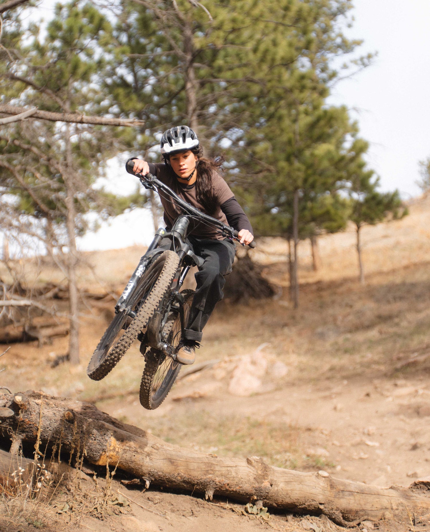 Rivers mountain biking in black utility pants