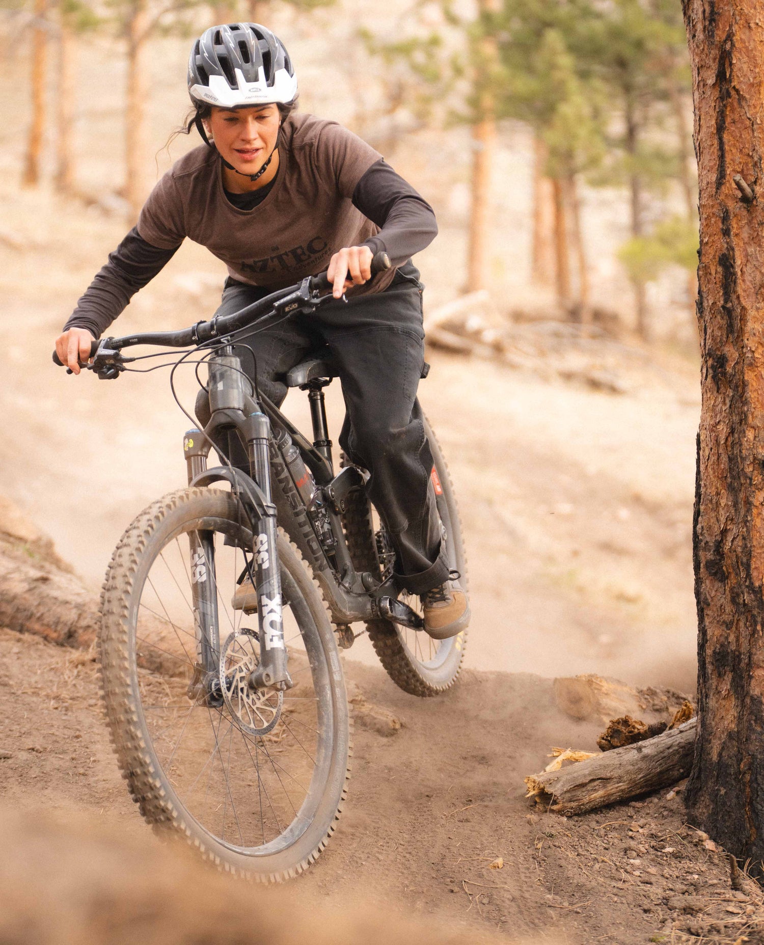Rivers mountain biking in black utility pants