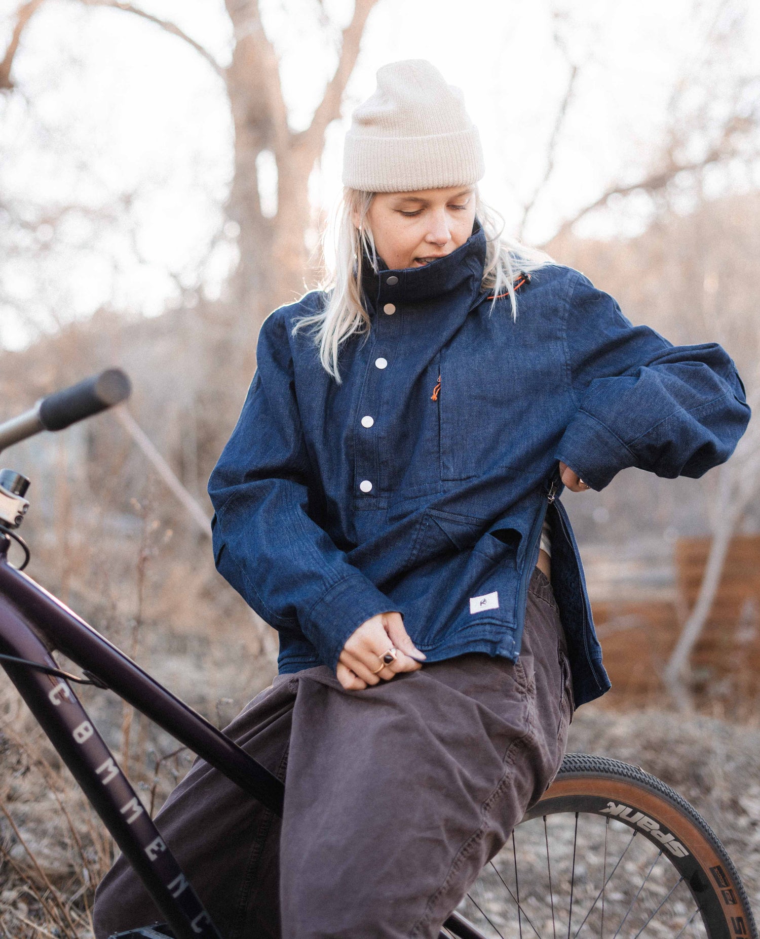 Blonde lady on a bike in the Anorak
