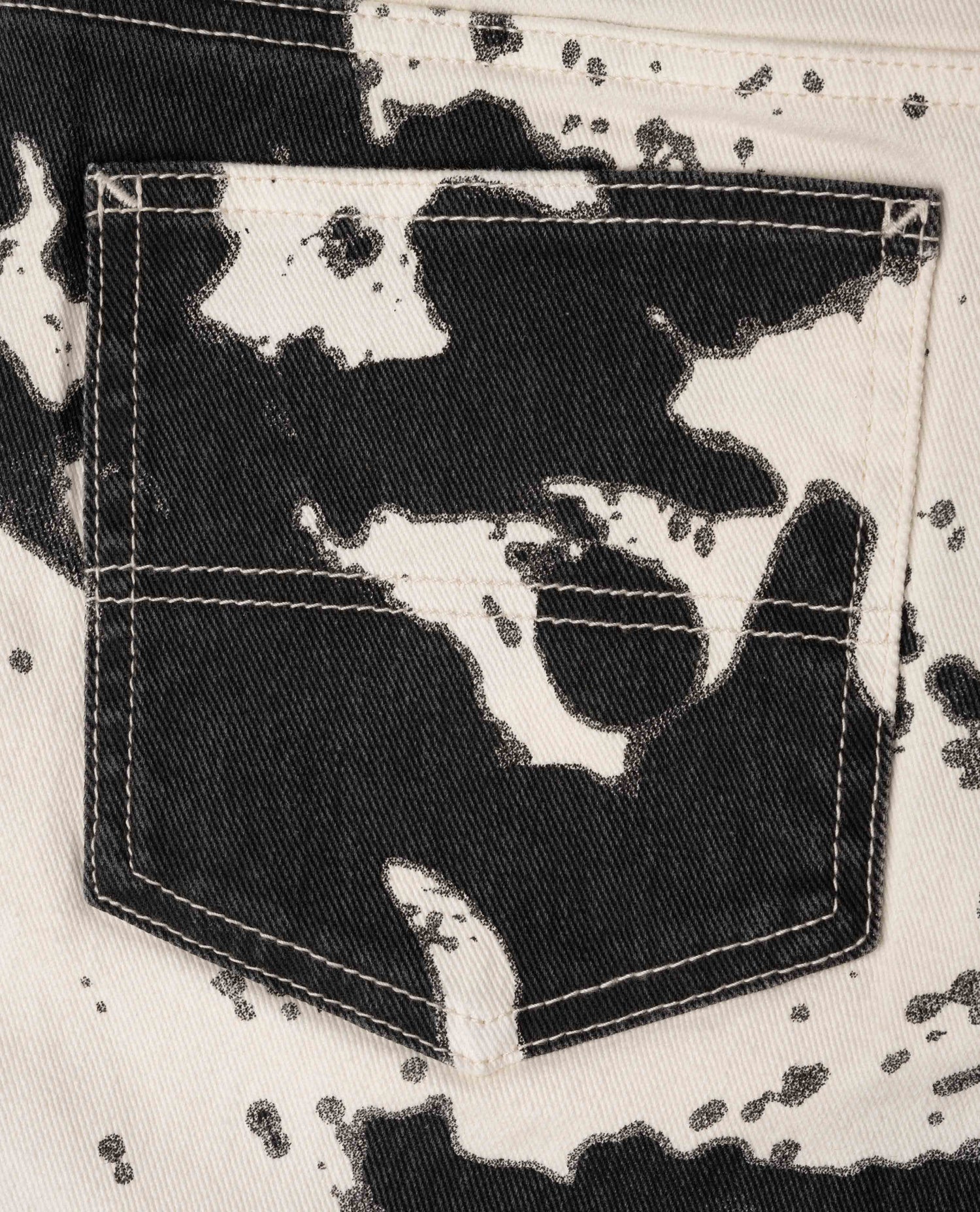 Close-up of a pocket with black and white abstract pattern on a textured background