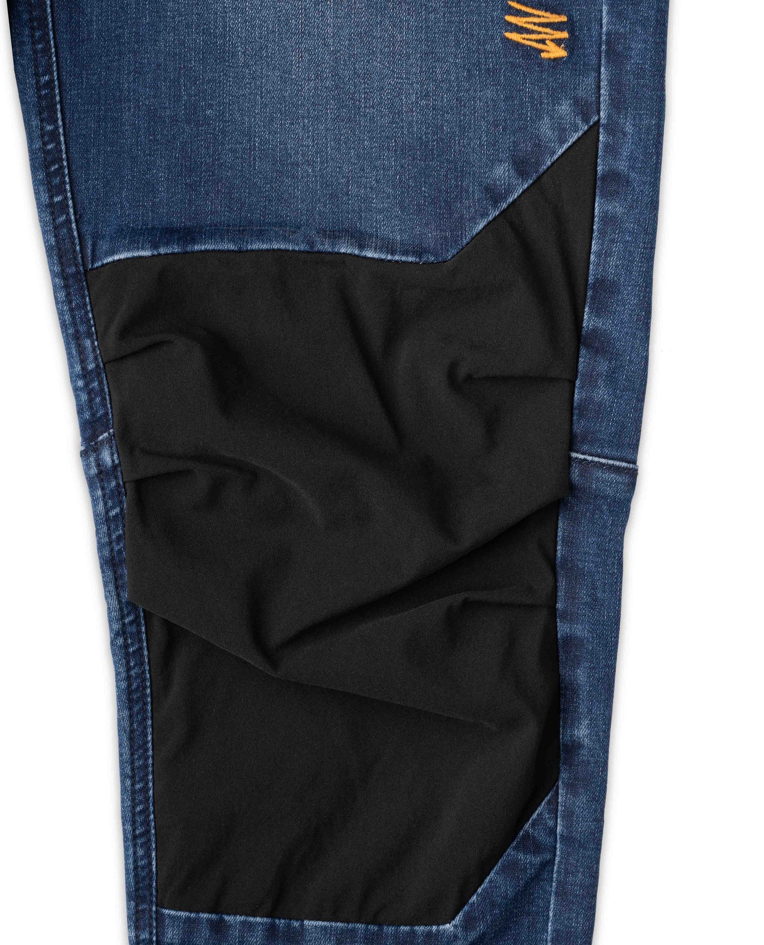 Women's Denim Bike Pant in studio knee detail