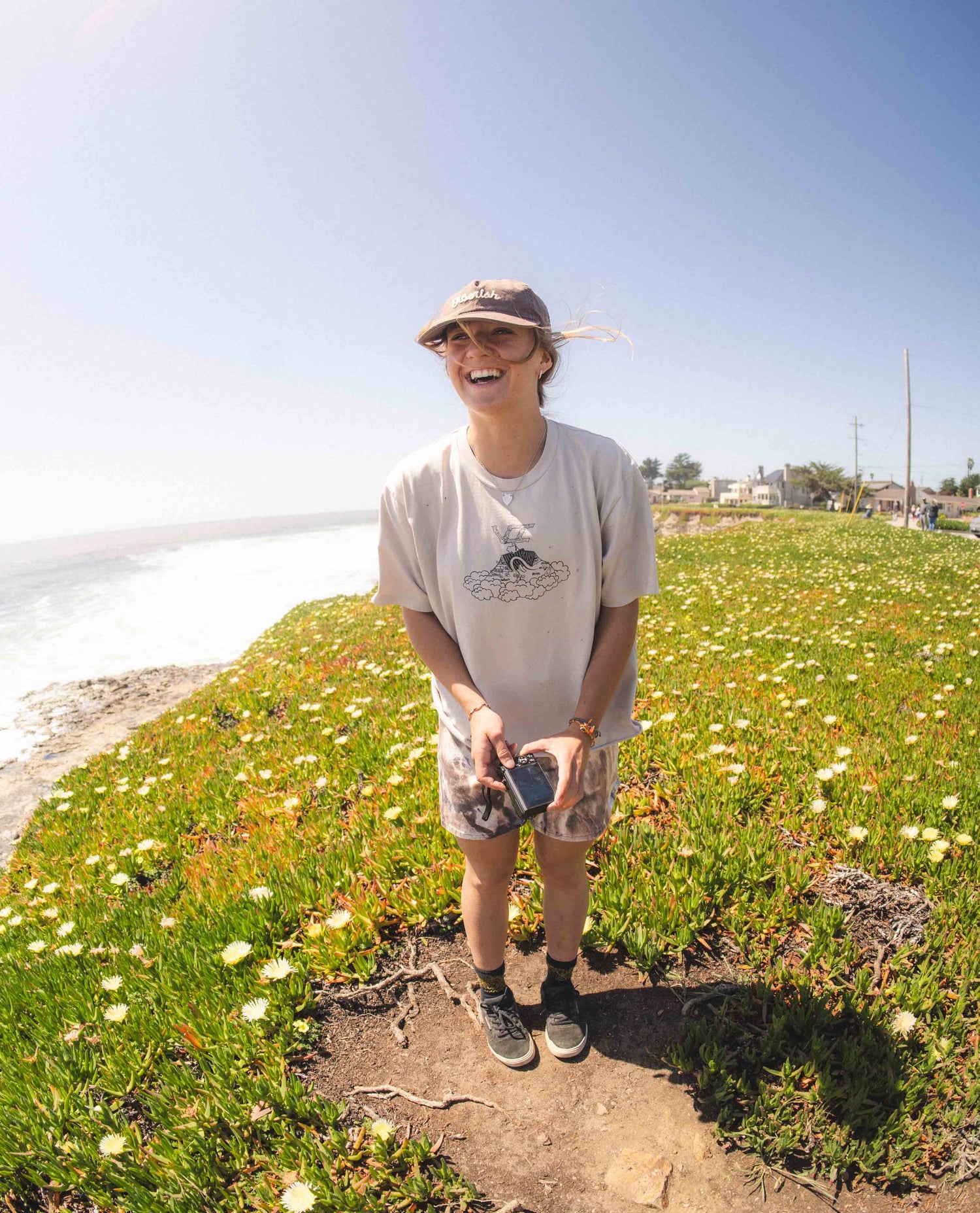 person in a field in fungi shorts