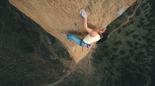 Women climbing on scenic wall. 