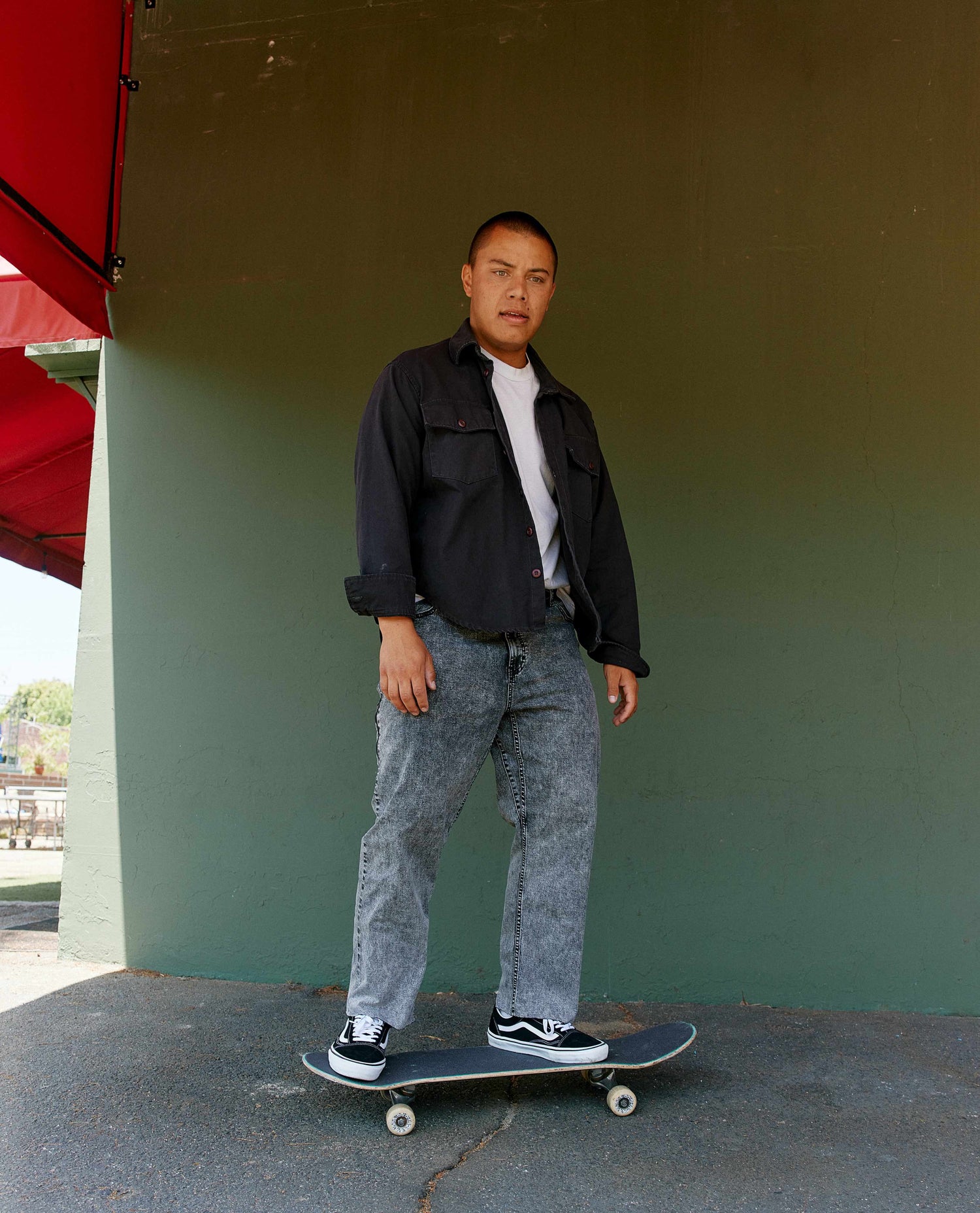 skateboarder in grey superlite jeans