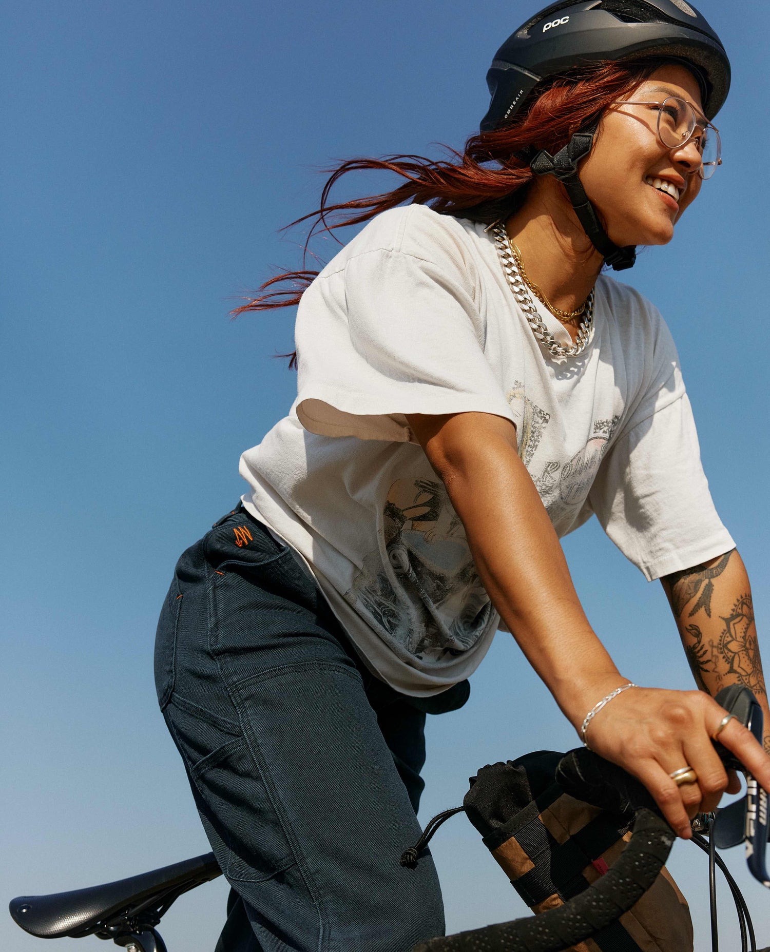 woman riding bike in blue sport utility pant