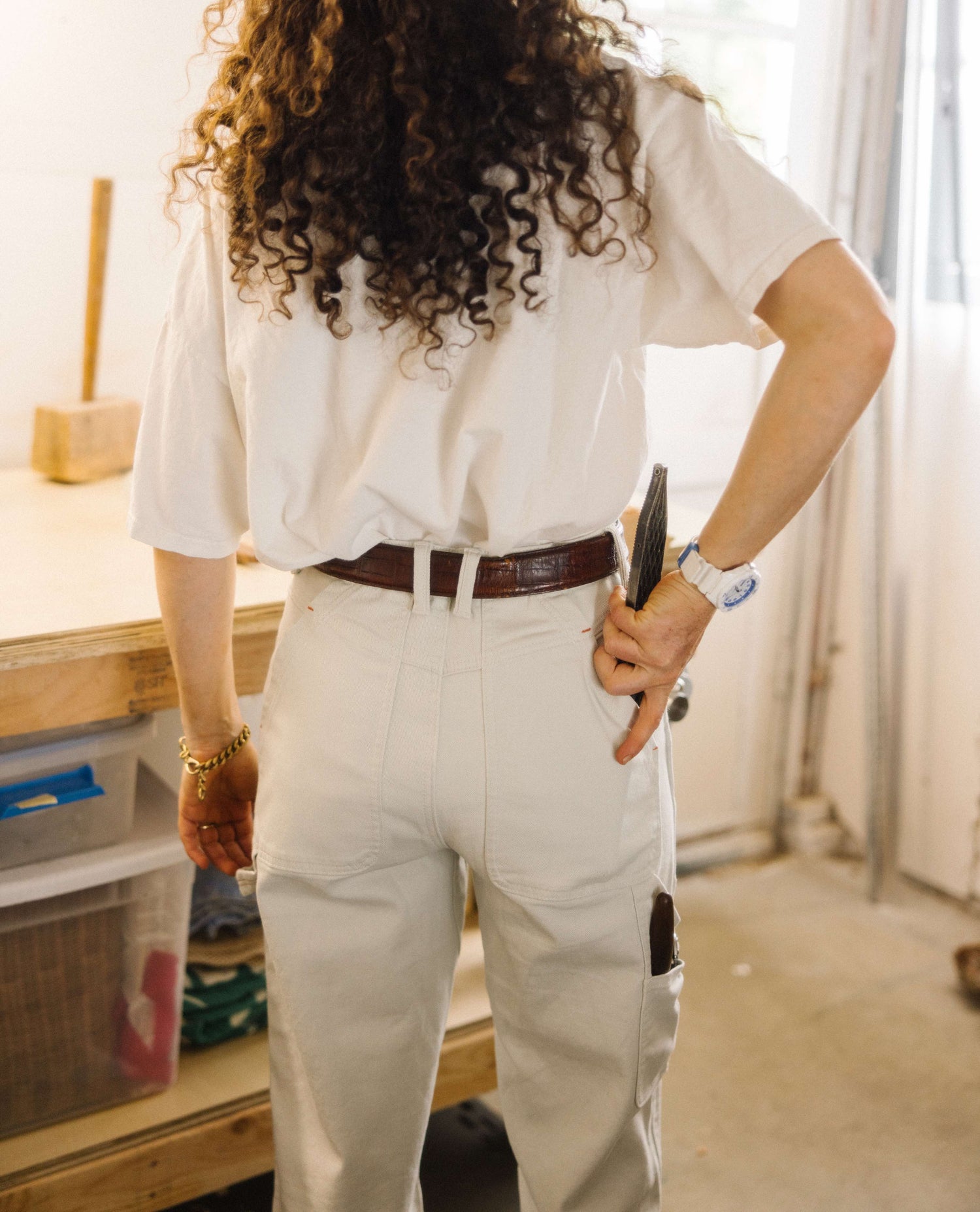 woman in white sport utility pants