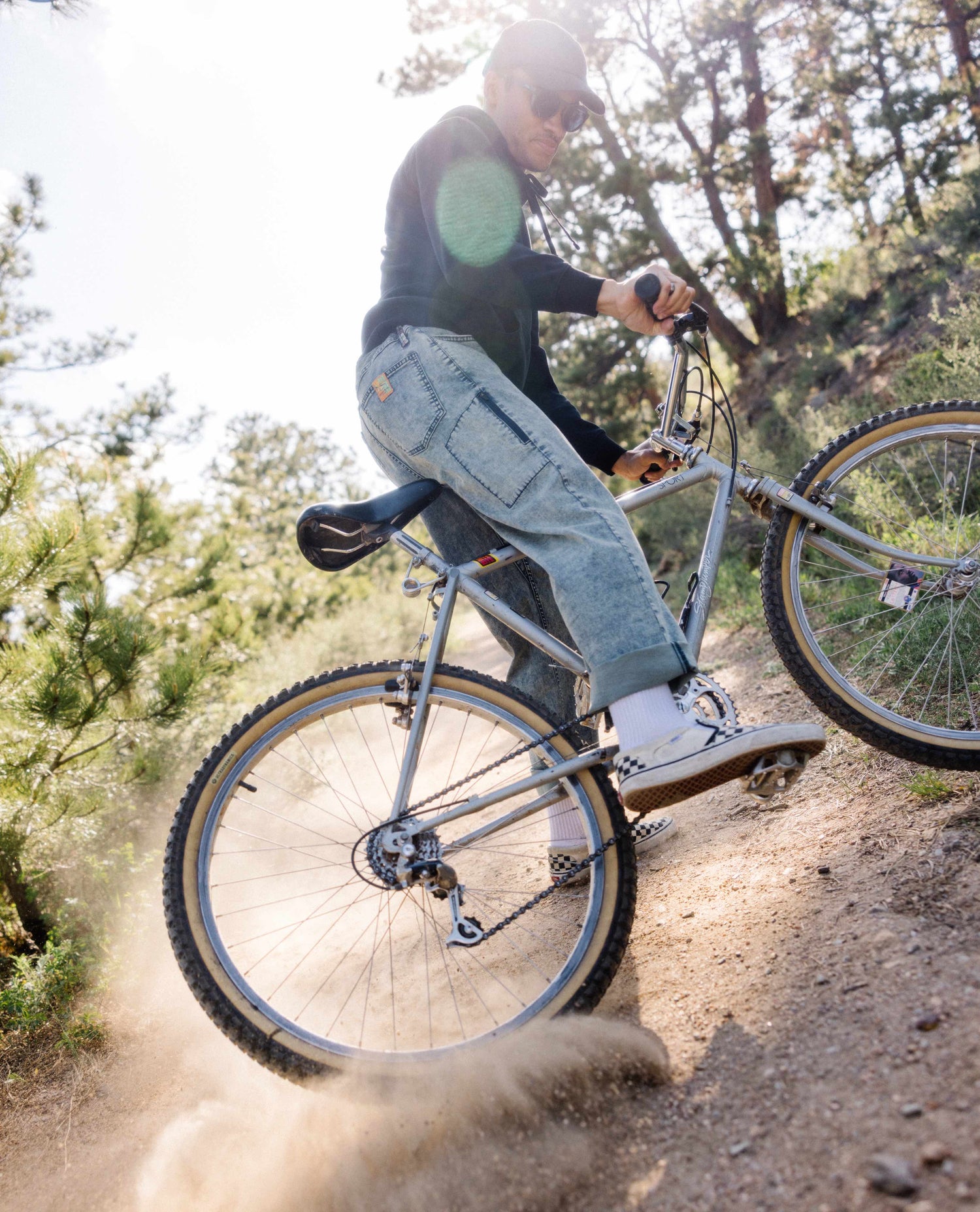 Man riding bike in superlite jeans