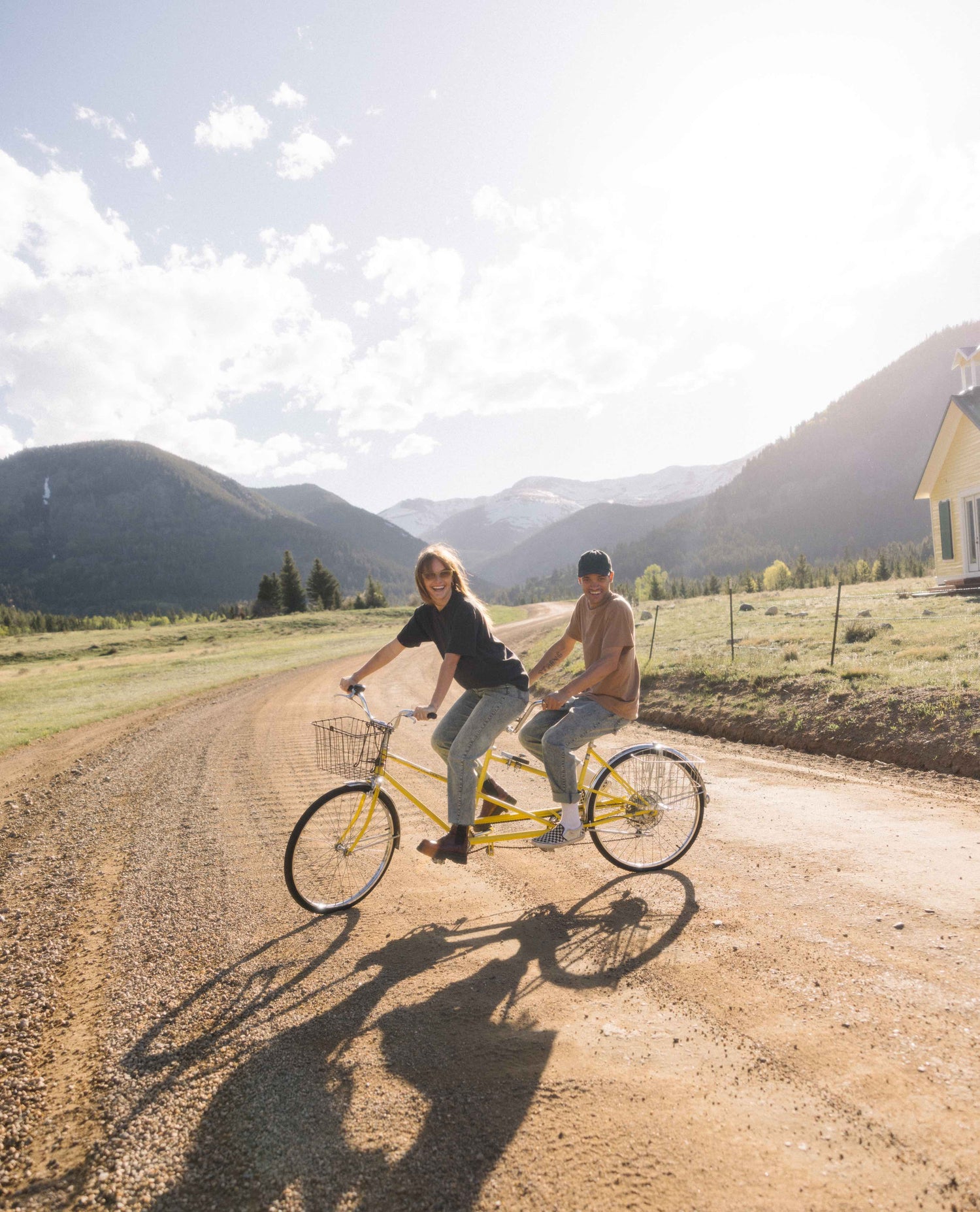 Couple riding a bike in superlite jeans