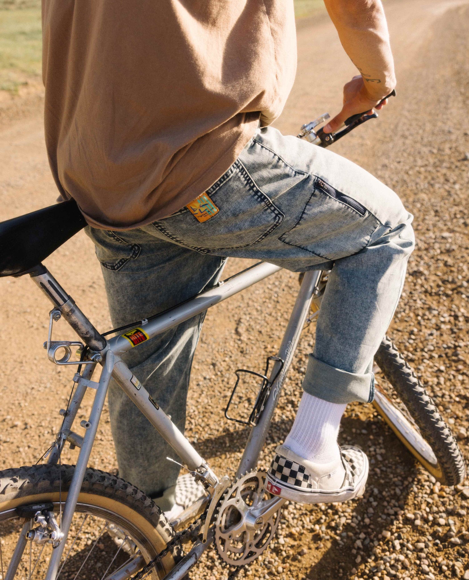 mean on bike in superlite jeans