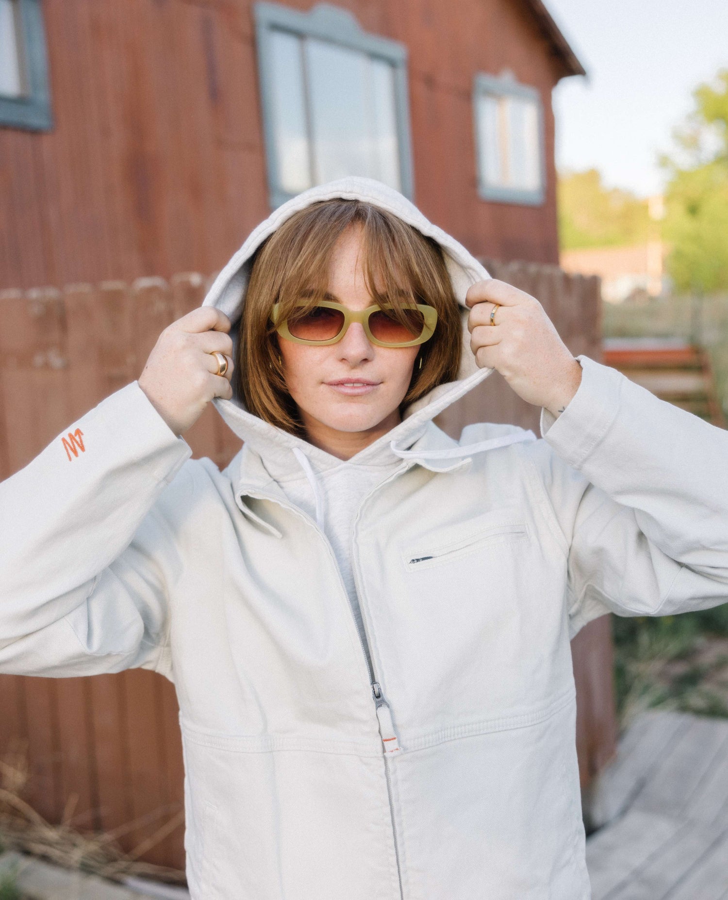 woman wearing white sport utility jacket. 