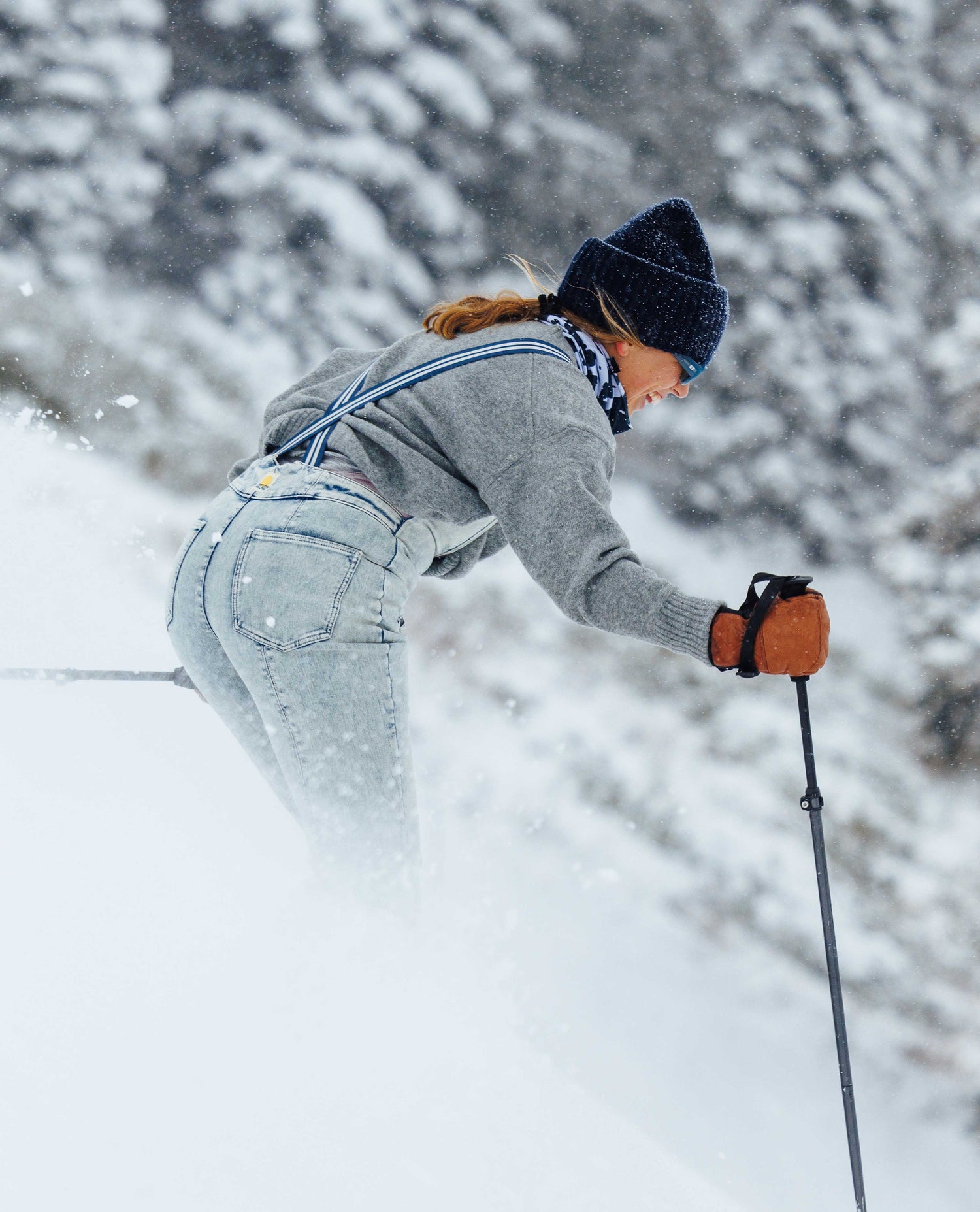Person cross-country skiing in a snowy landscape with trees.