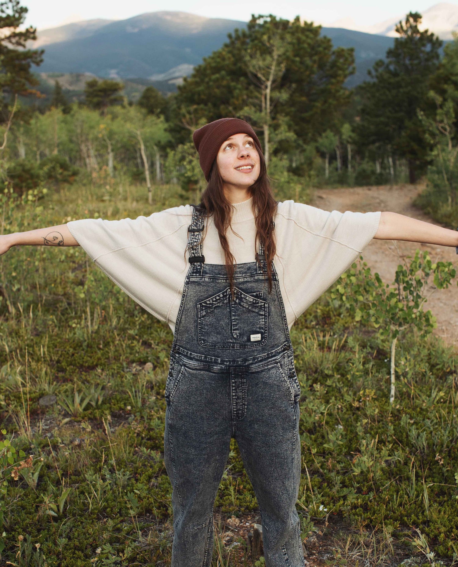 Girl wearing Starving Jartist Overalls