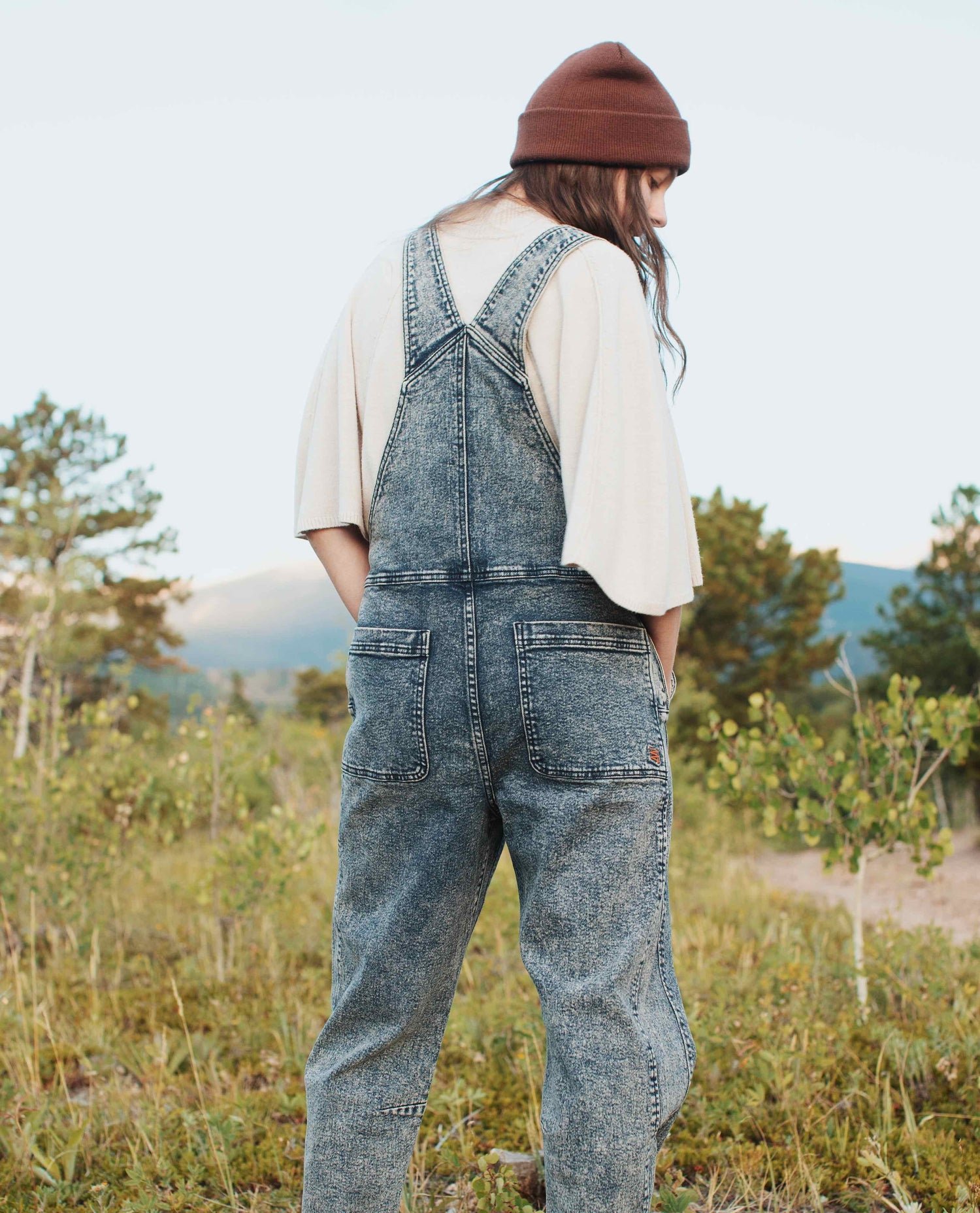 Girl wearing Starving Jartist Overalls back