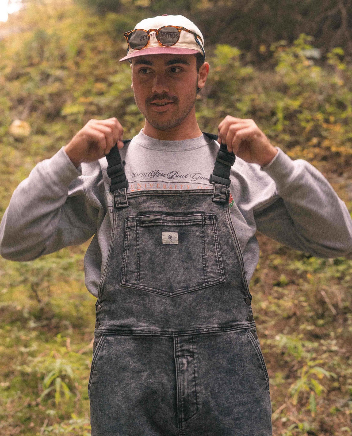 Man standing in Black Marble Overalls