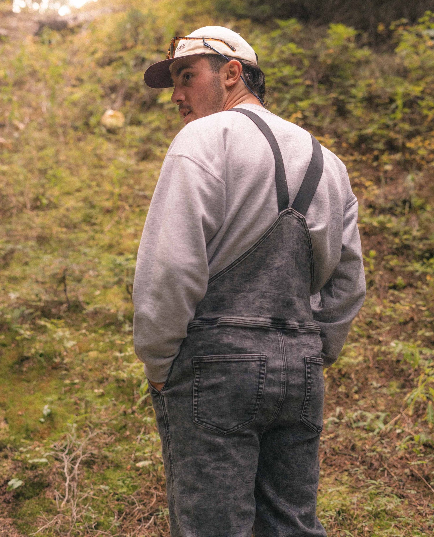 Man standing in Black Marble Overalls