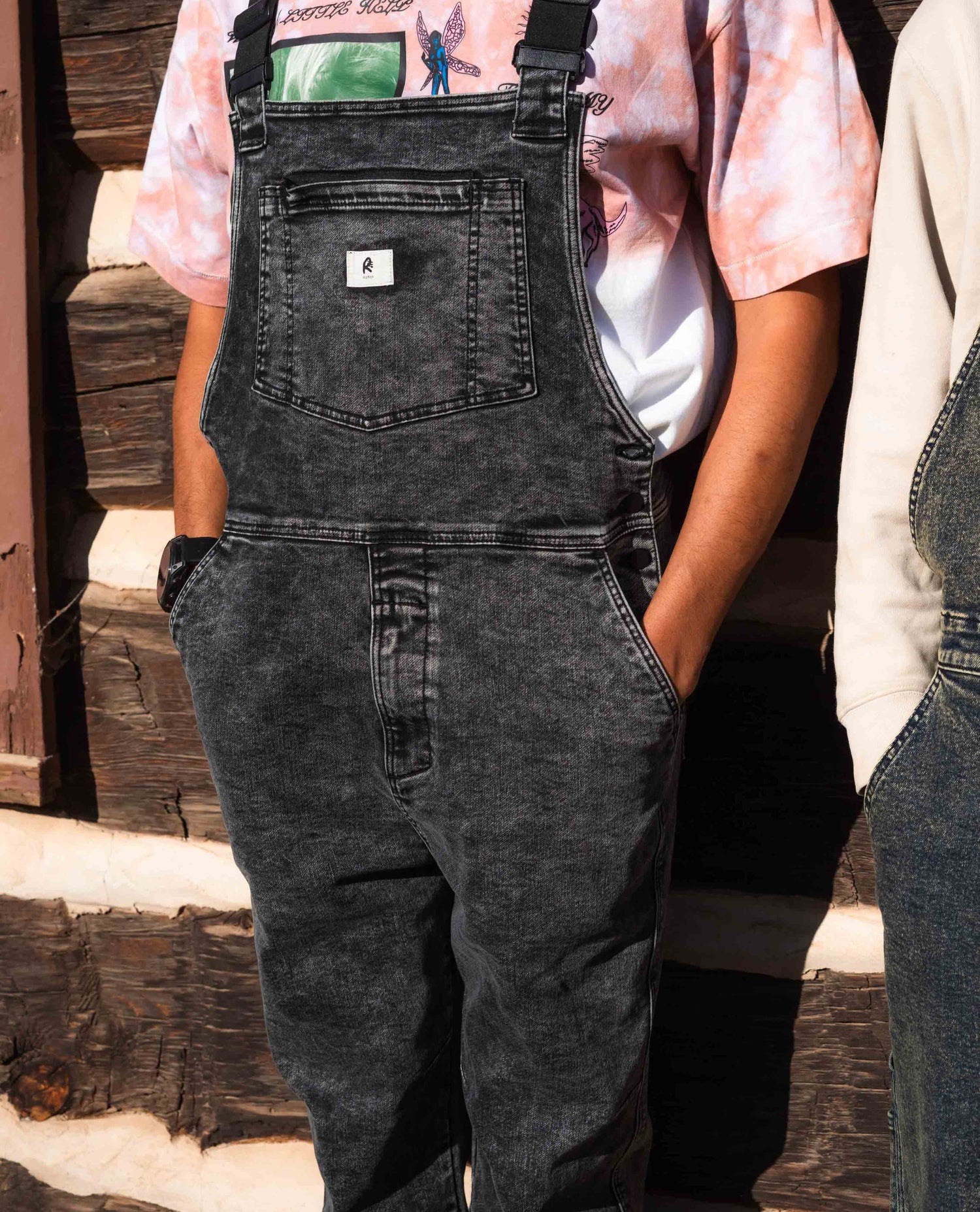 Man standing in Black Marble Overalls