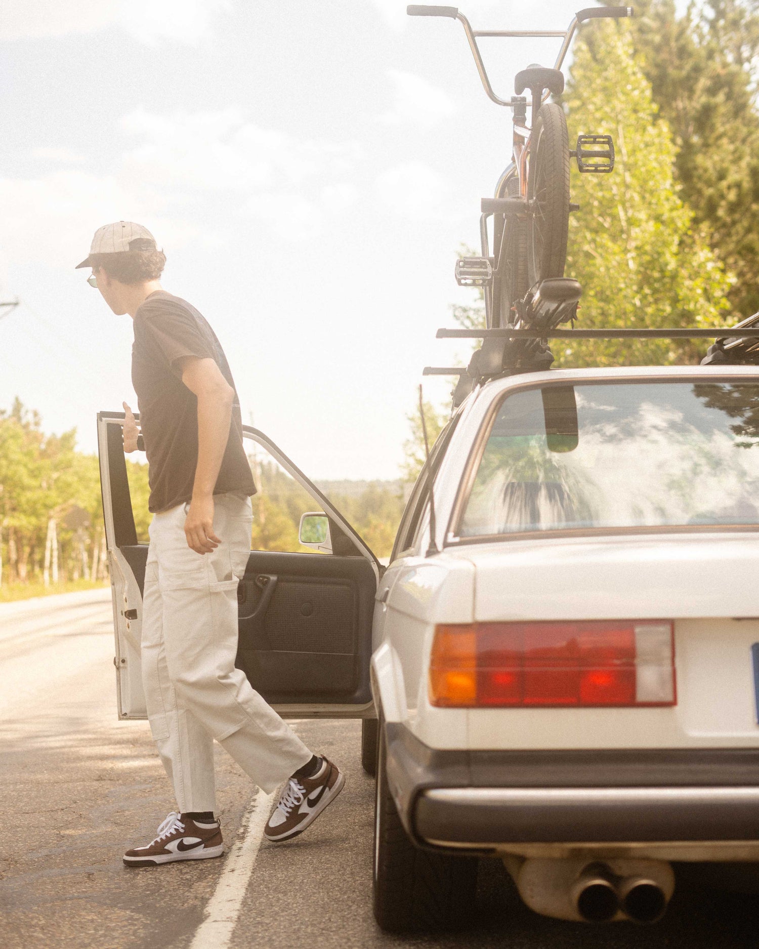 Guy getting out of his car in Sport Utility Pants