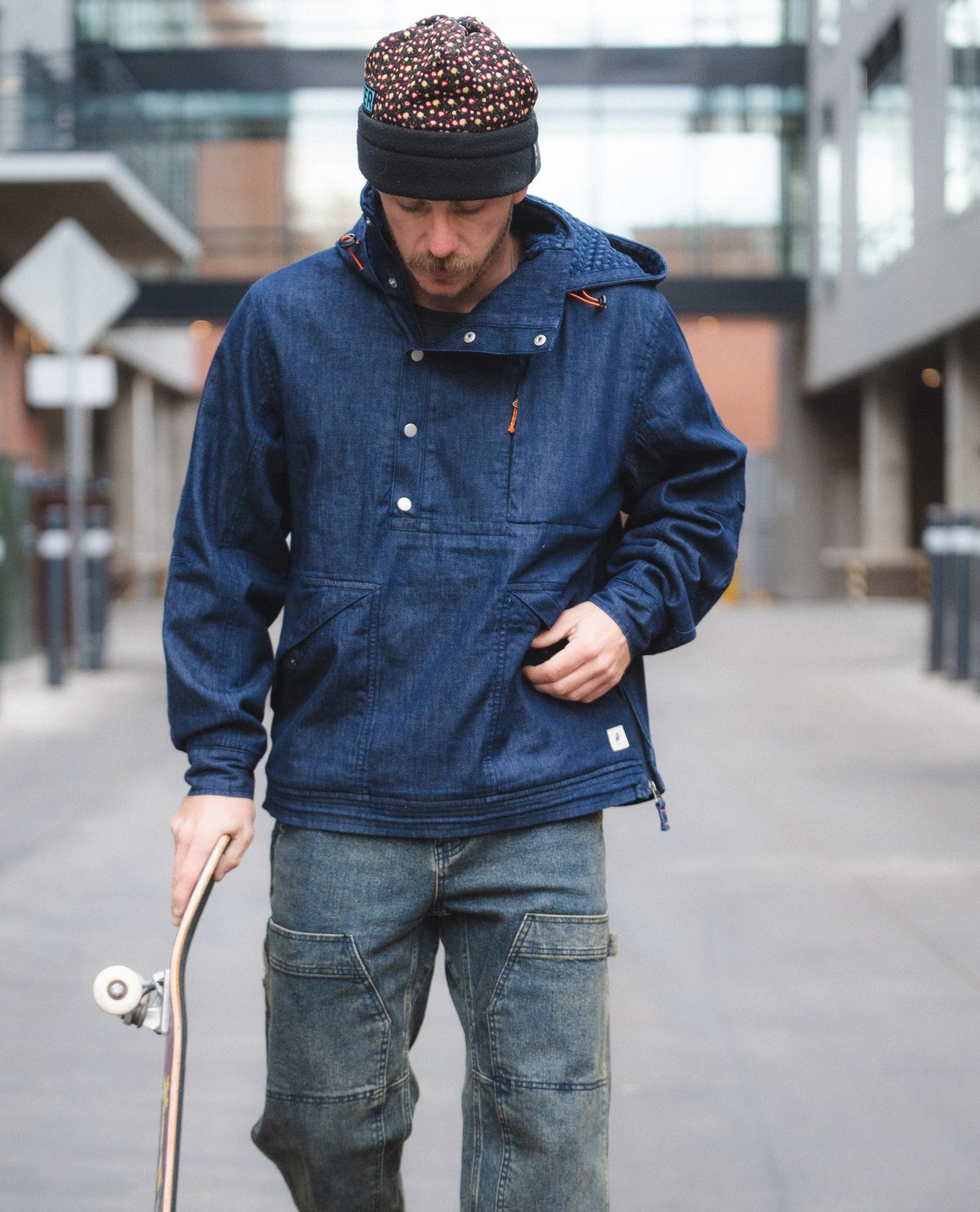 Kody wearing a denim anorak 