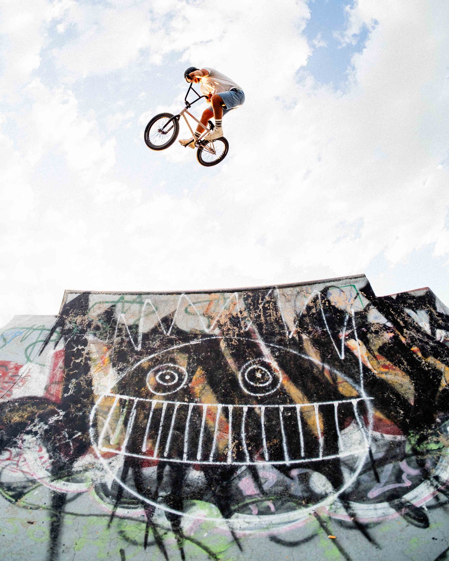 rider in jorts getting big air