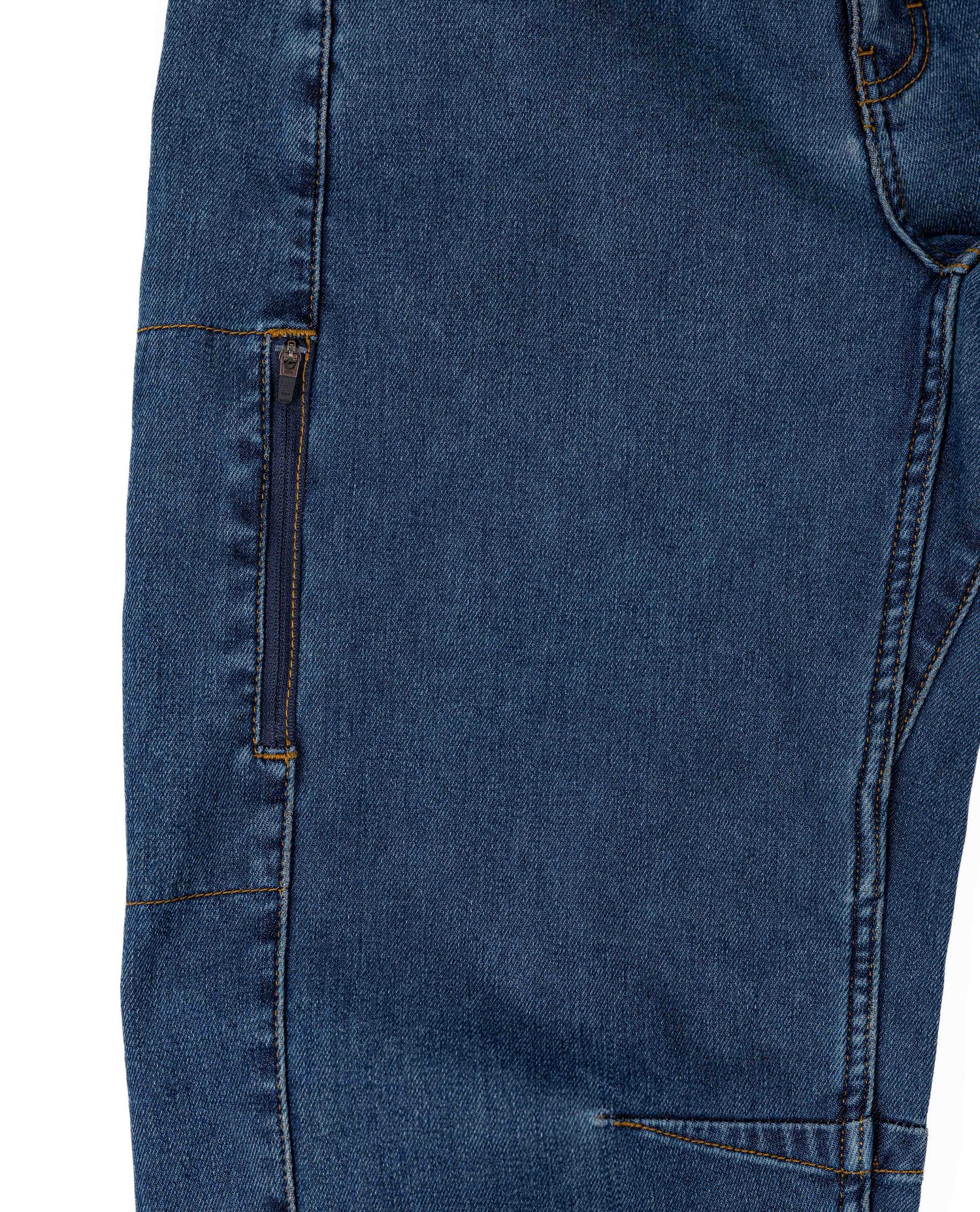 Close-up of blue denim jeans on a white background