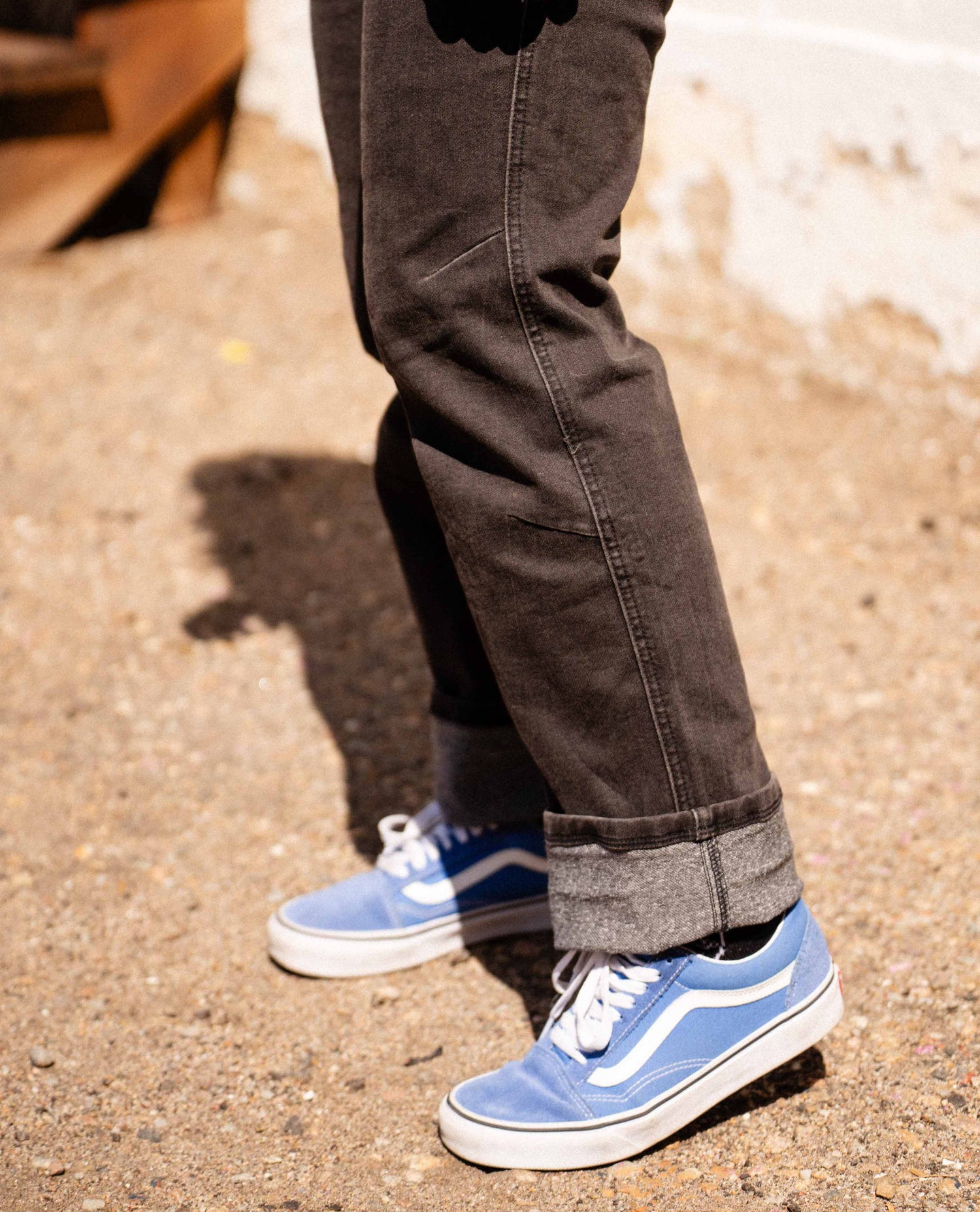 Woman standing in Diesel Overalls. 