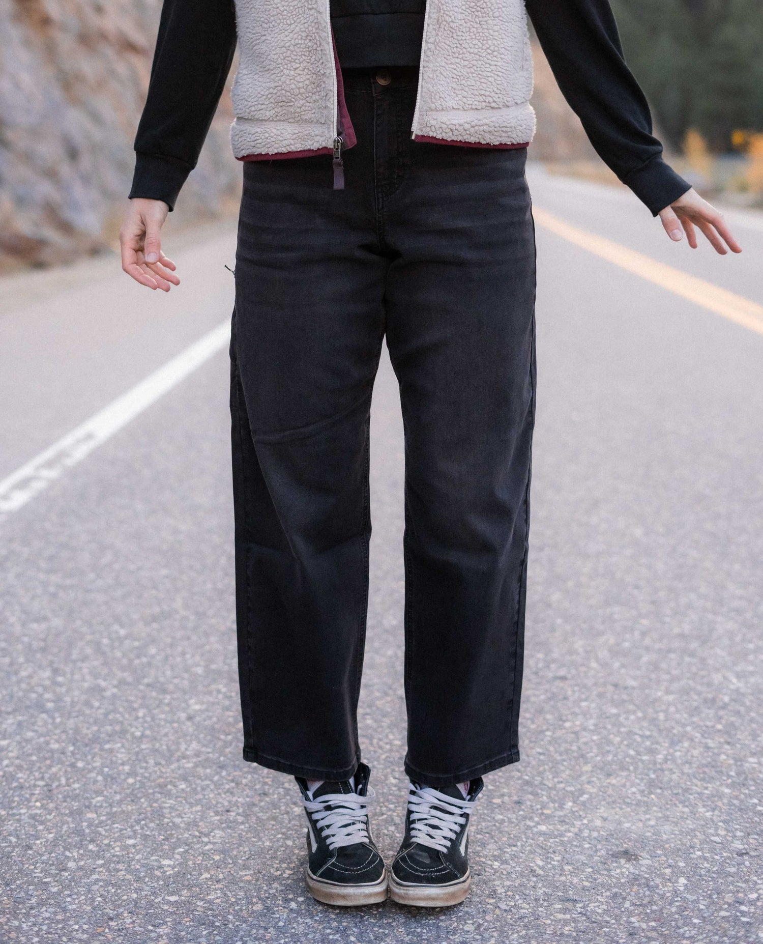 Woman standing in the road in her Ripton Superlite jeans. 