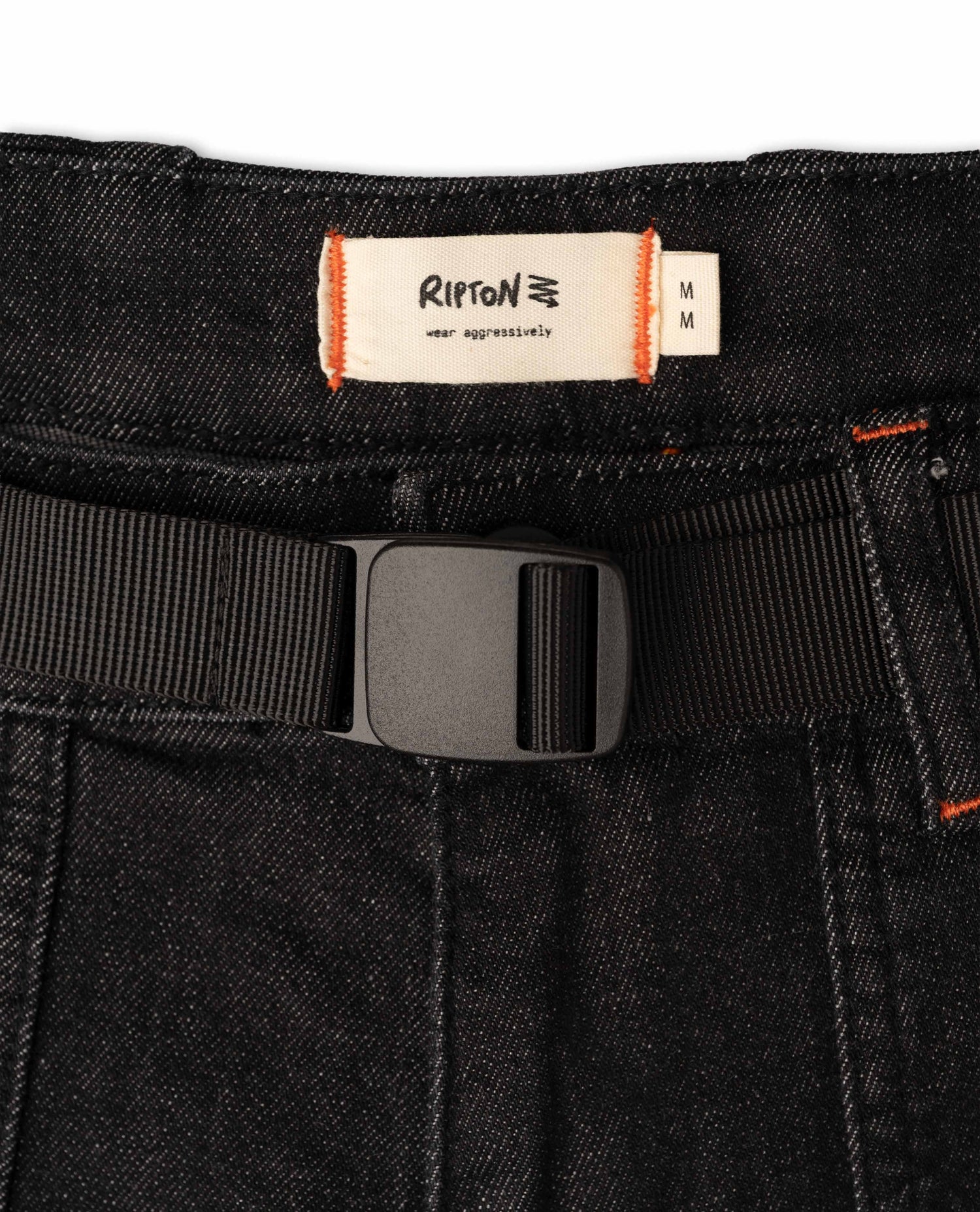 Close-up of a black belt with a Ripton label on a white background