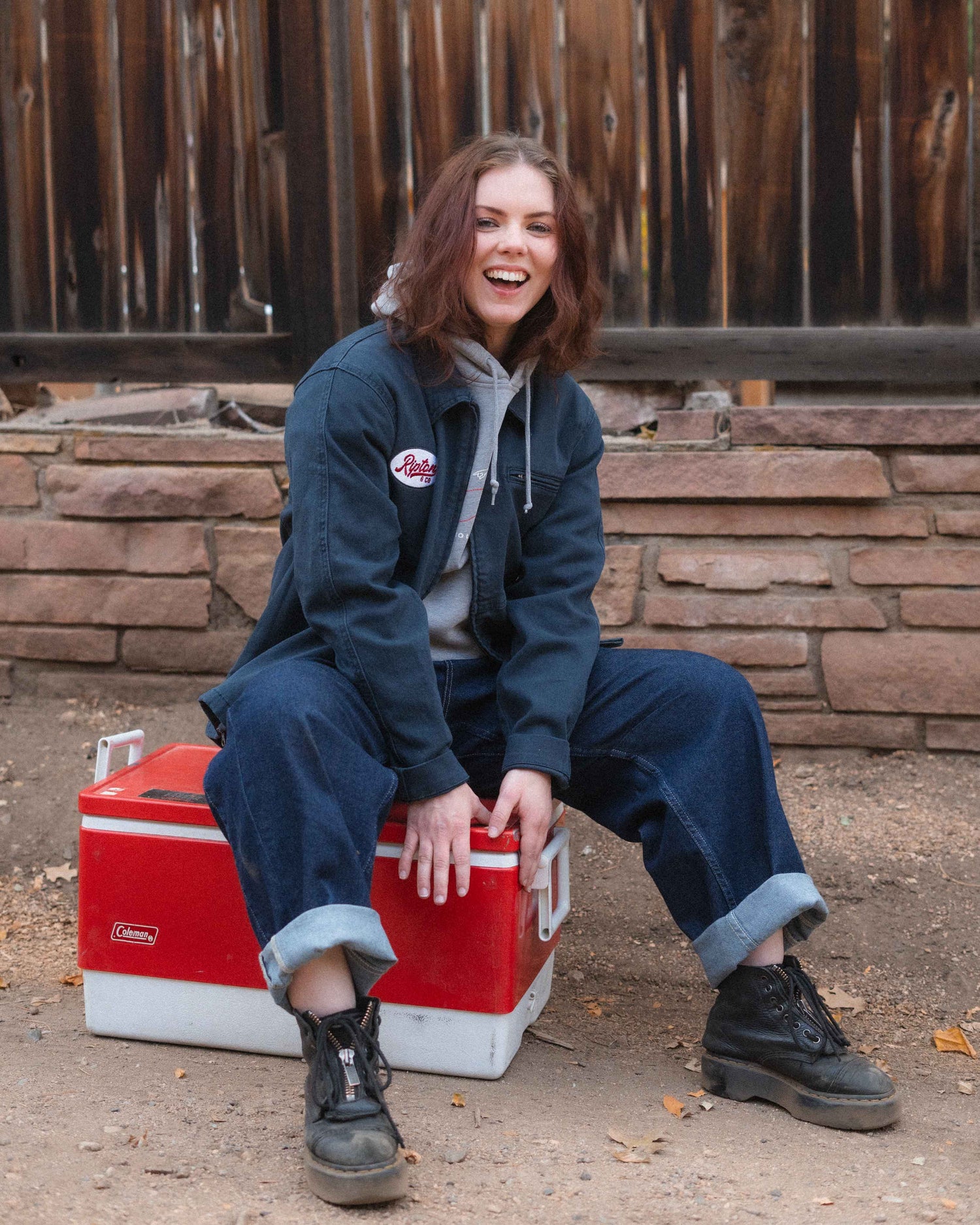 Girl in Navy jacket with mechanics embroidery