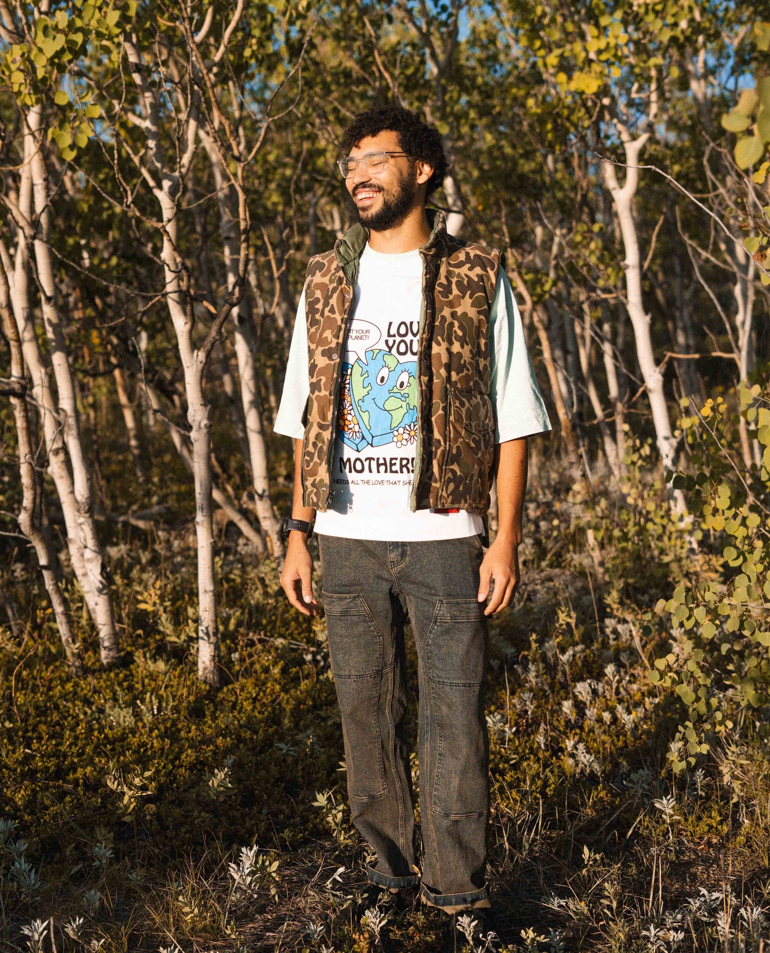 a guy wearing sport utility jeans in a forest