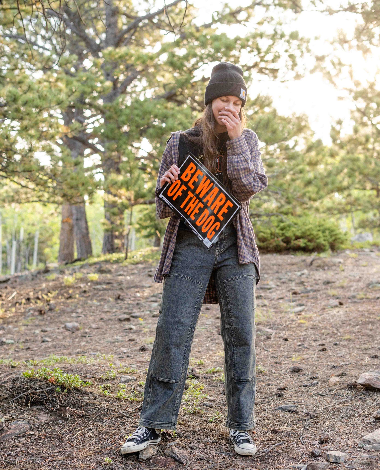 Girl with a Beware of Dog sign