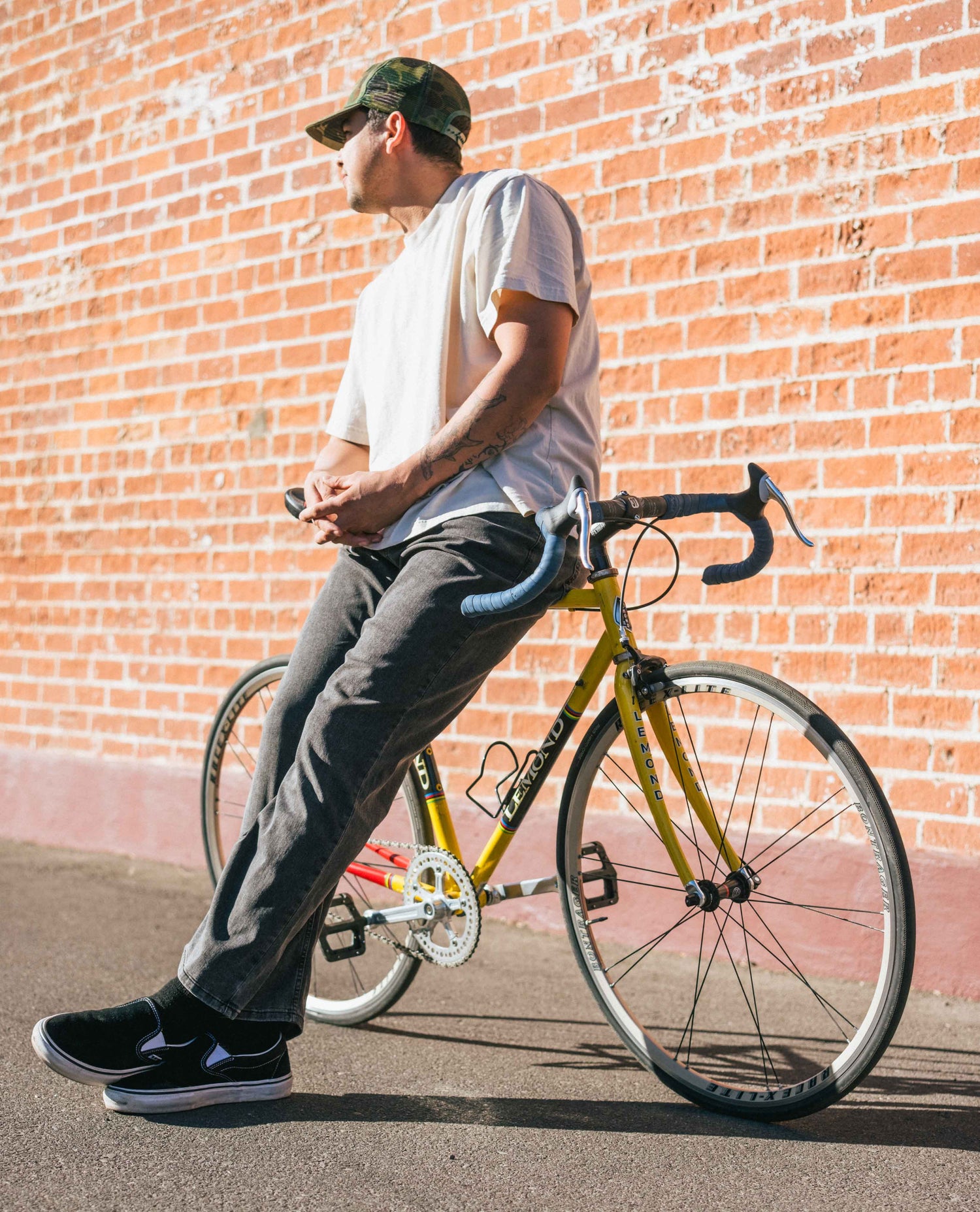 Nate and bike with Men's Superlite Smudge jeans