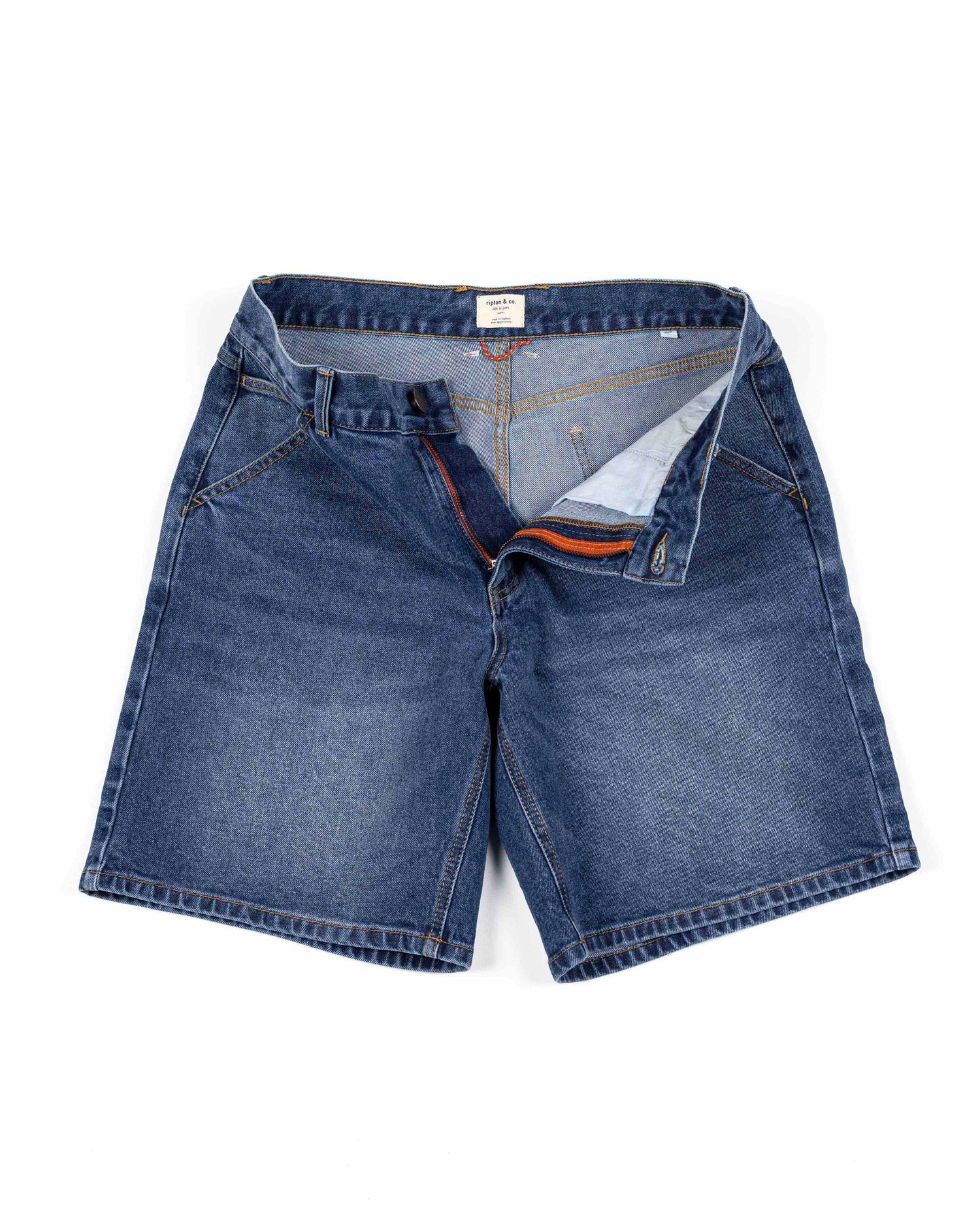 An unzipped pair of jean shorts. 