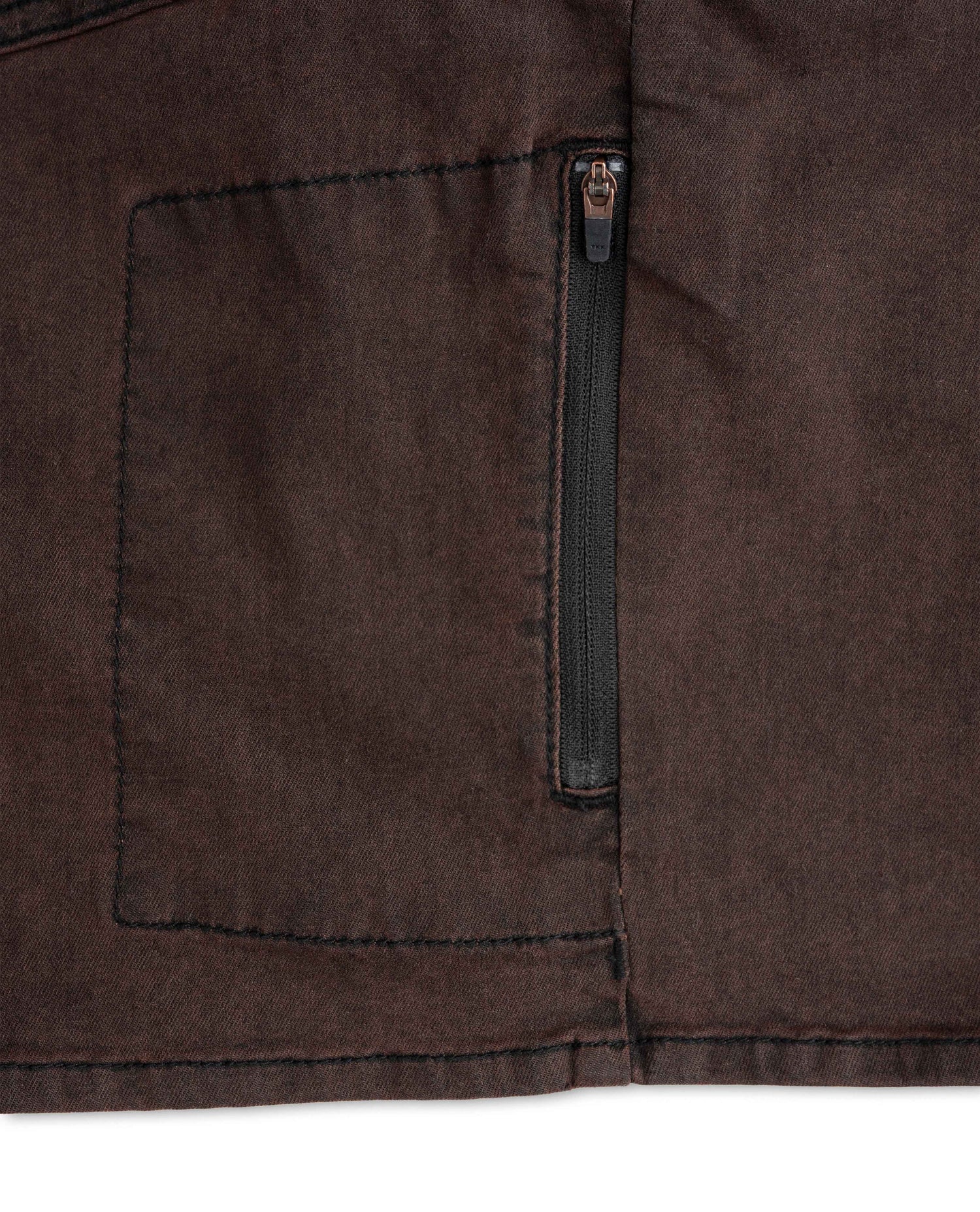 Close-up of a brown jacket with a zipper pocket on a white background