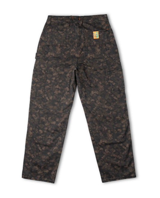 Camouflage pants laying on white background
