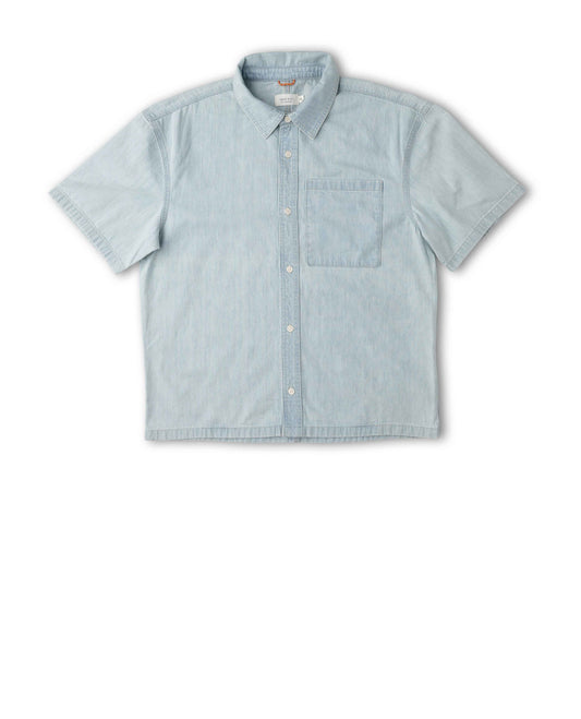 A light blue short-sleeve button-up shirt with a chest pocket, laid flat against a white background.