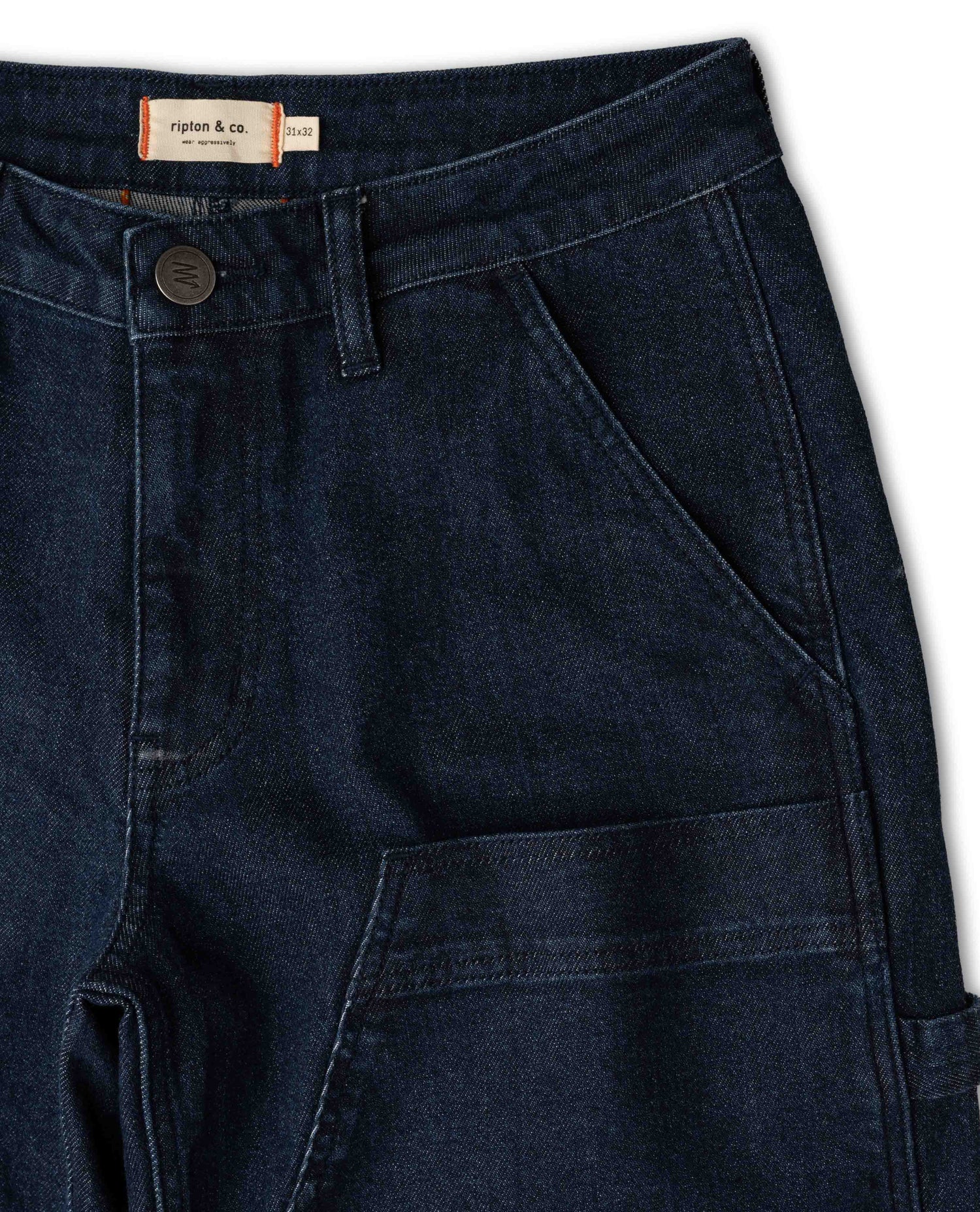 Dark blue jeans with a brand label on a white background