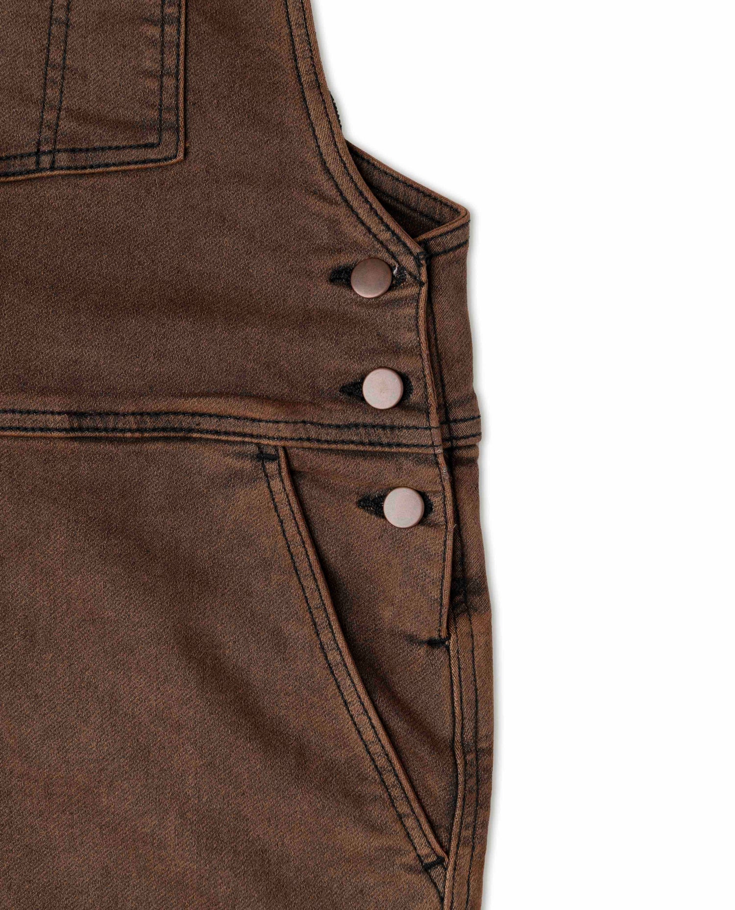 Rust overalls in studio details