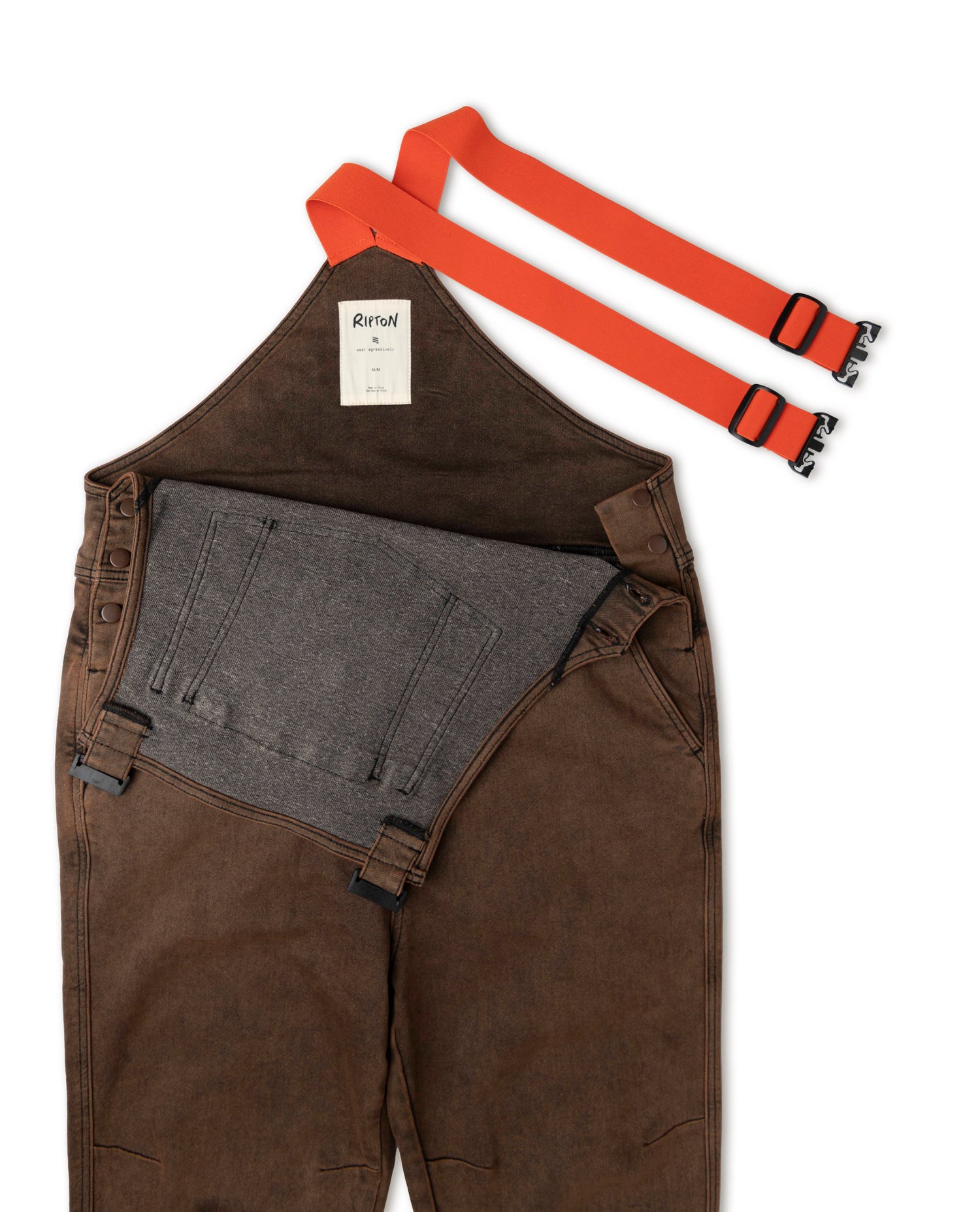 Rust overalls in studio details