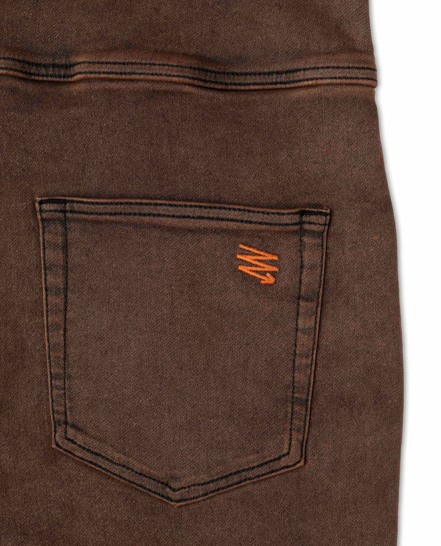 Rust overalls in studio details