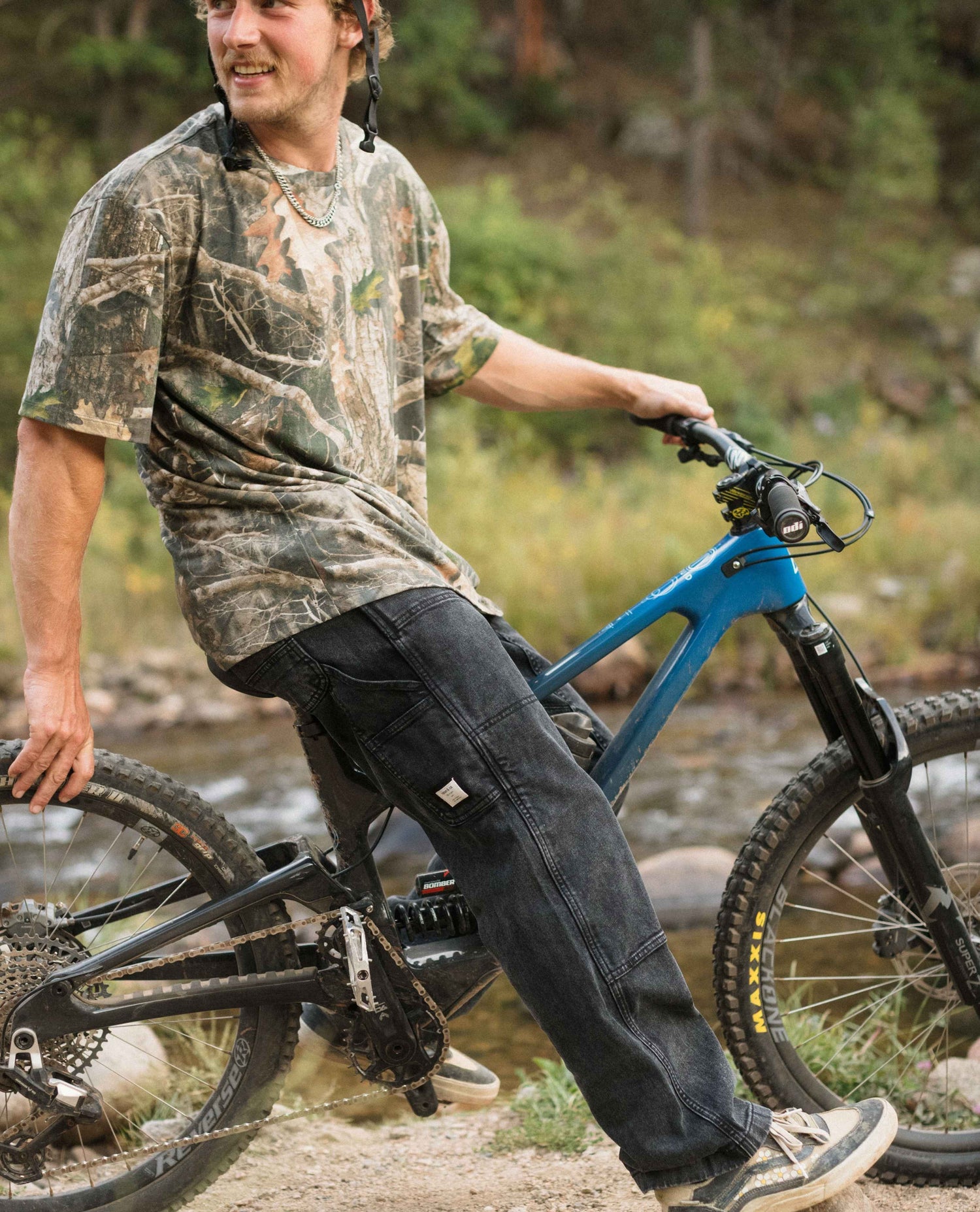 Man riding a mountain bike on a trail with a natural background