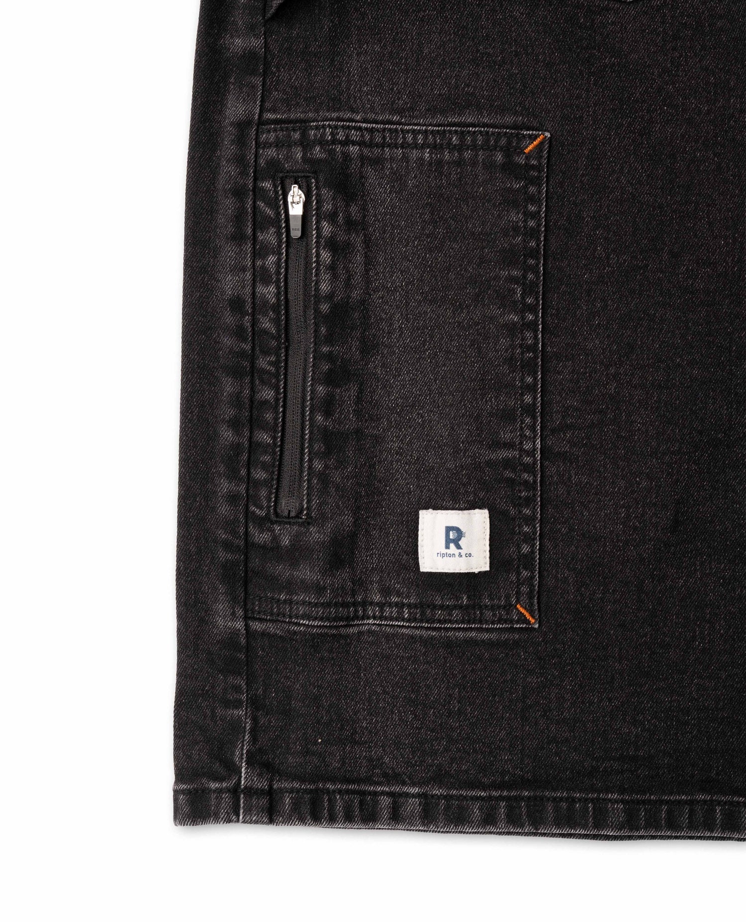 Black denim jacket with a brand logo on a white background