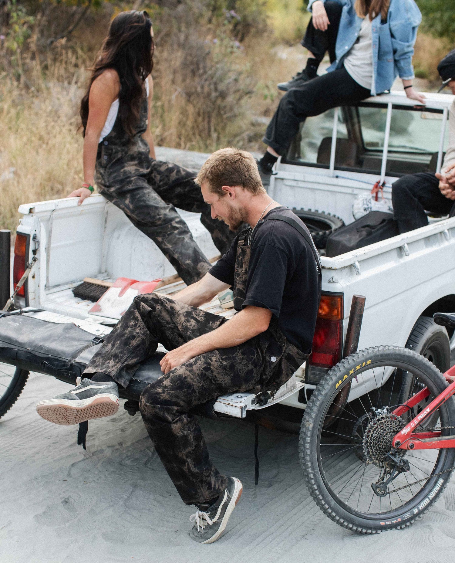 Hanging out in the back of a truck in Superlite overalls 